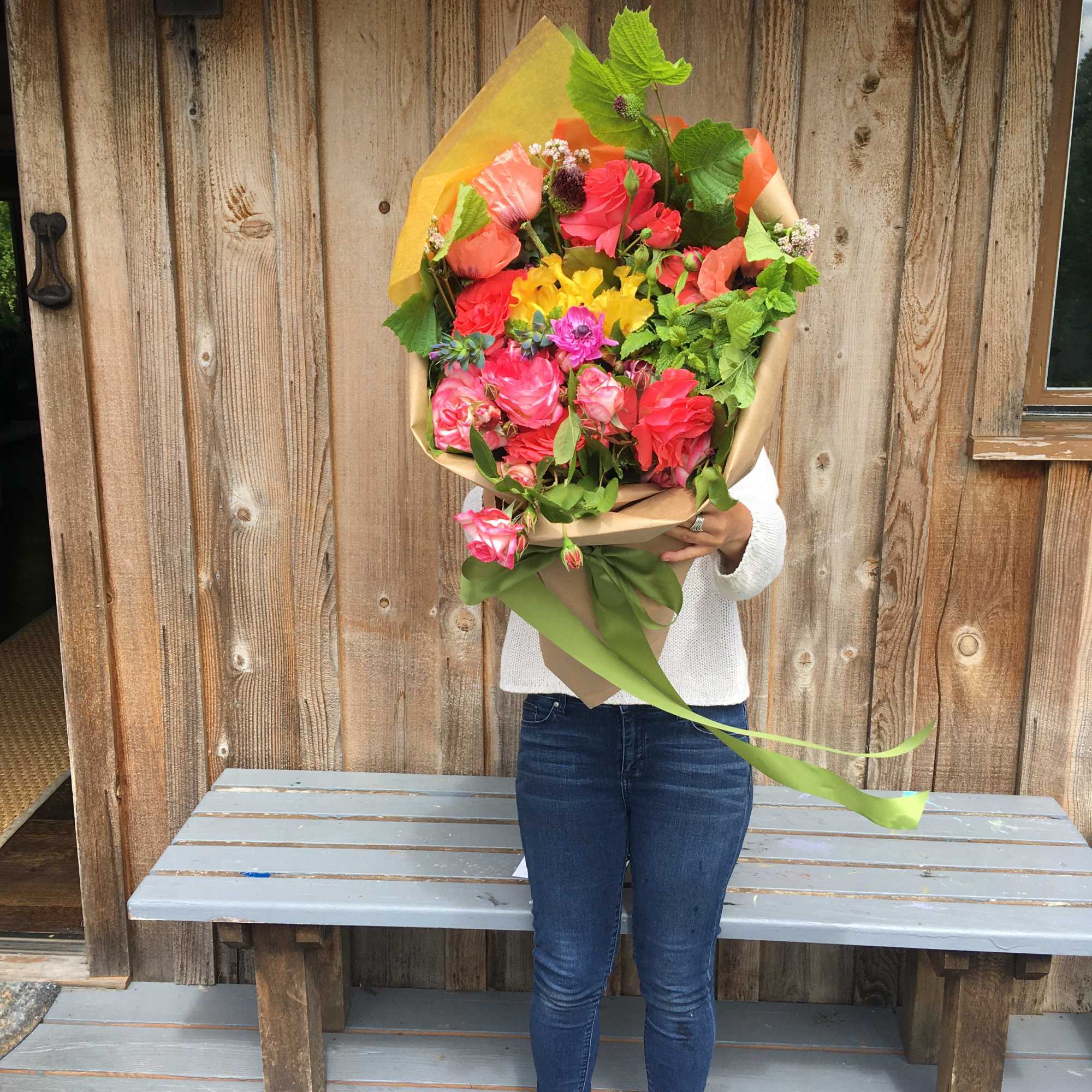 This arm load of blossoms in a seasonal pallet will make her