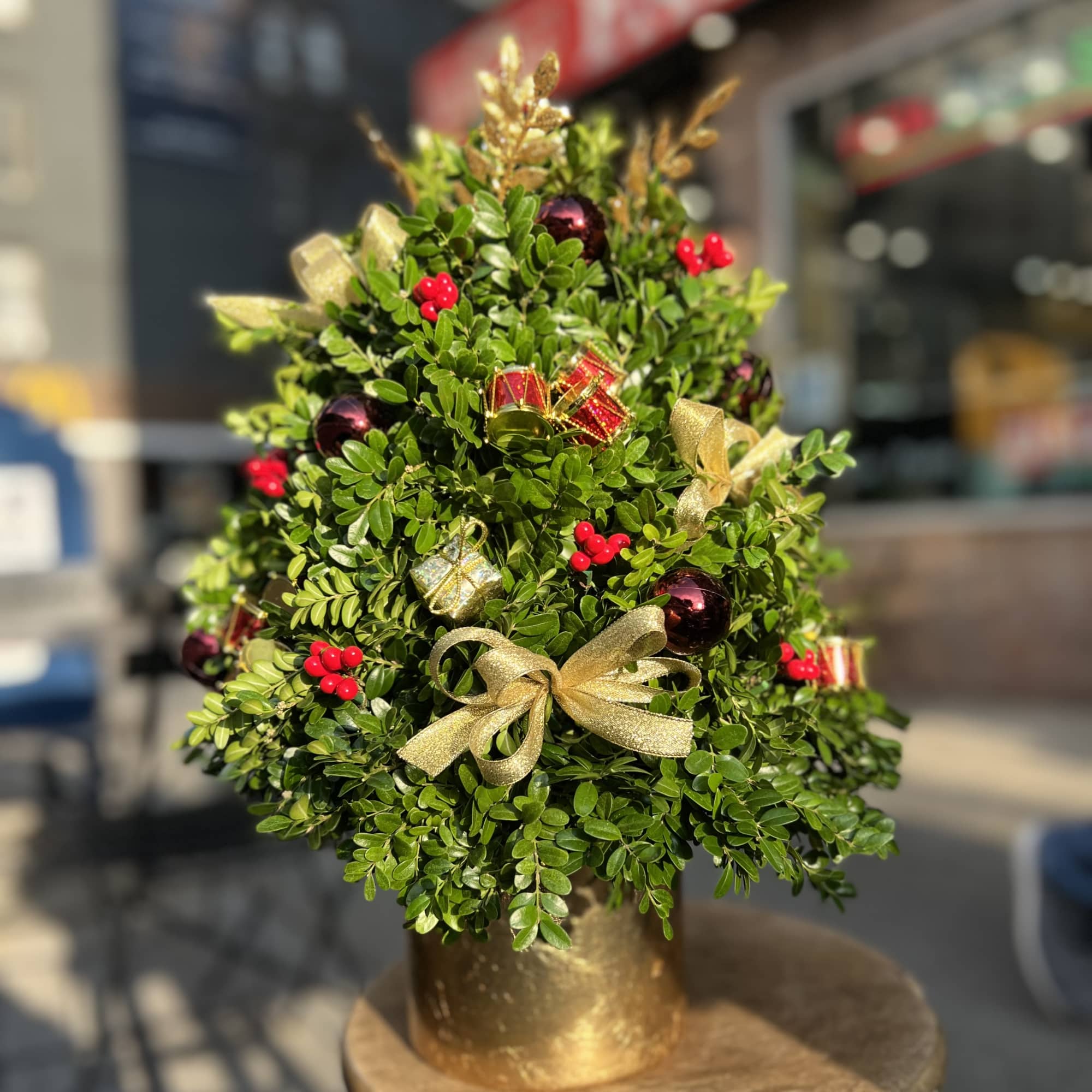 Decorated Christmas tree made of boxwood perfect for table tops.