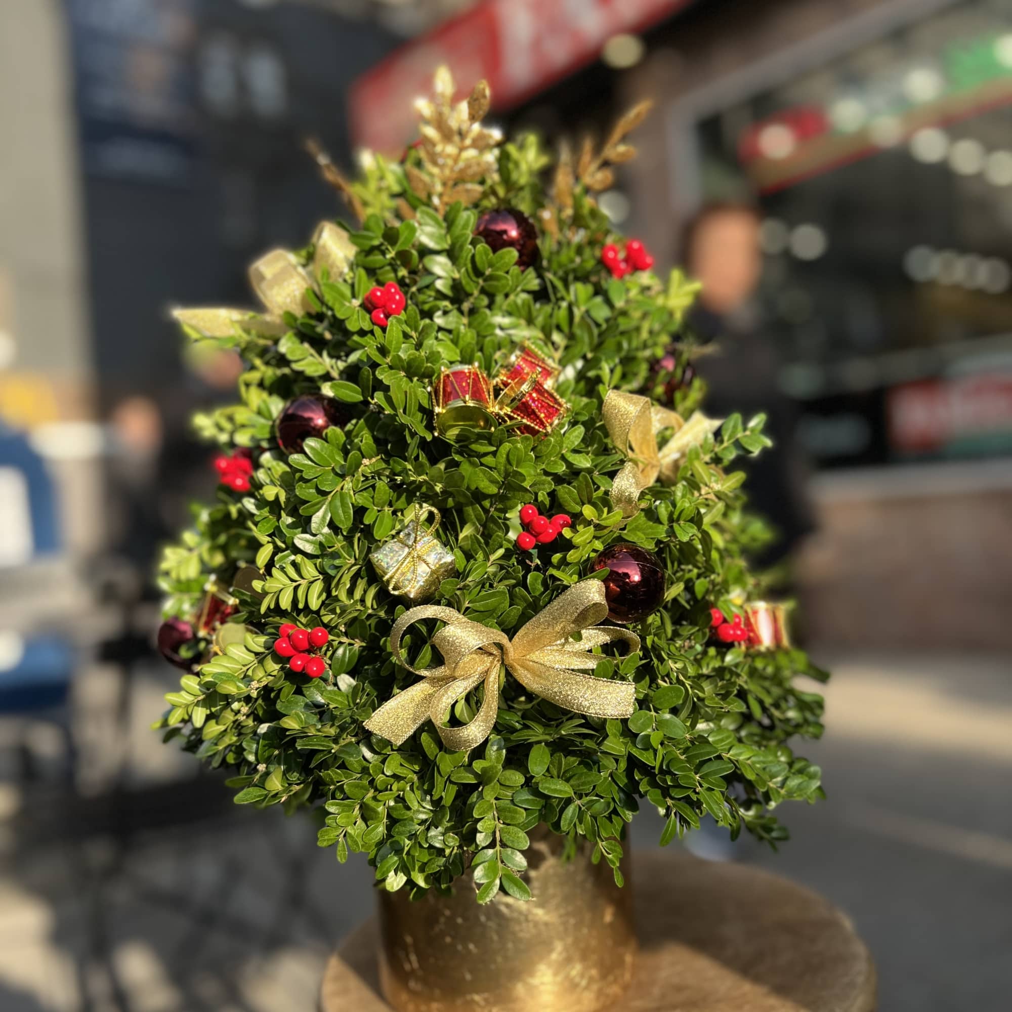 Decorated Christmas tree made of boxwood perfect for table tops.