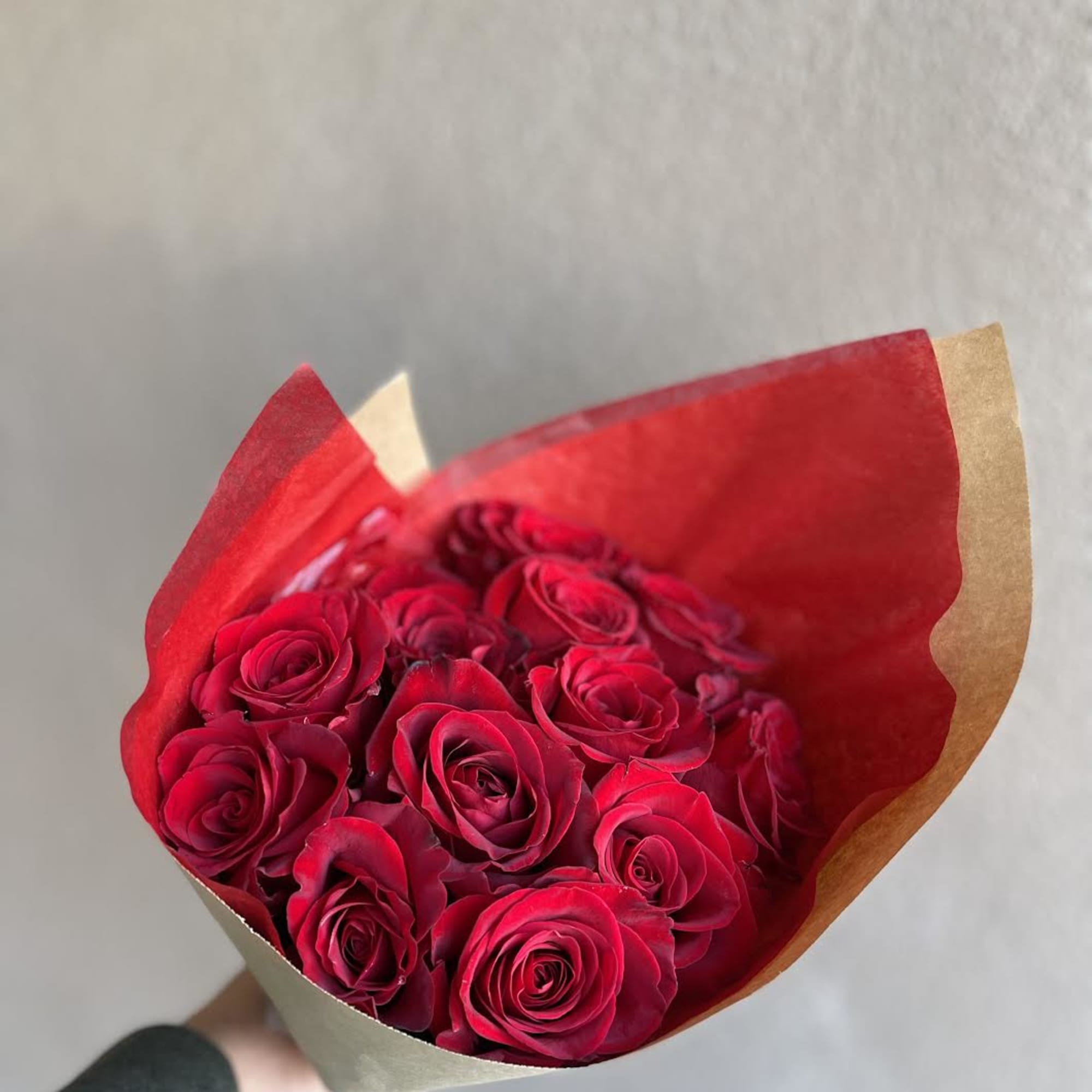 A hand tied bouquet of a dozen red roses for your sweetie.
