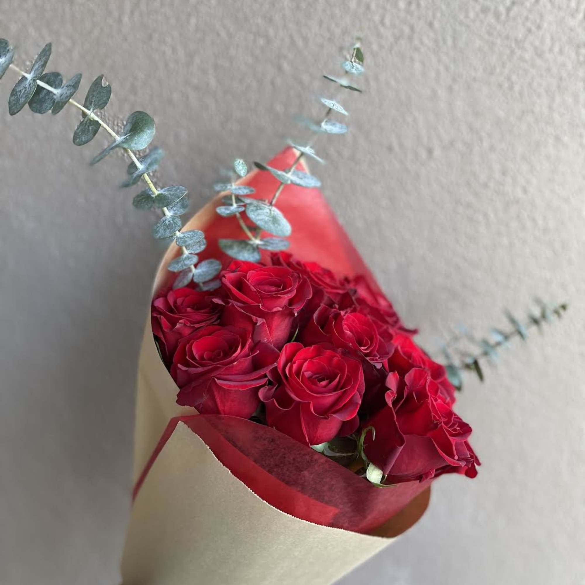 A hand tied bouquet of a dozen red roses for your sweetie.