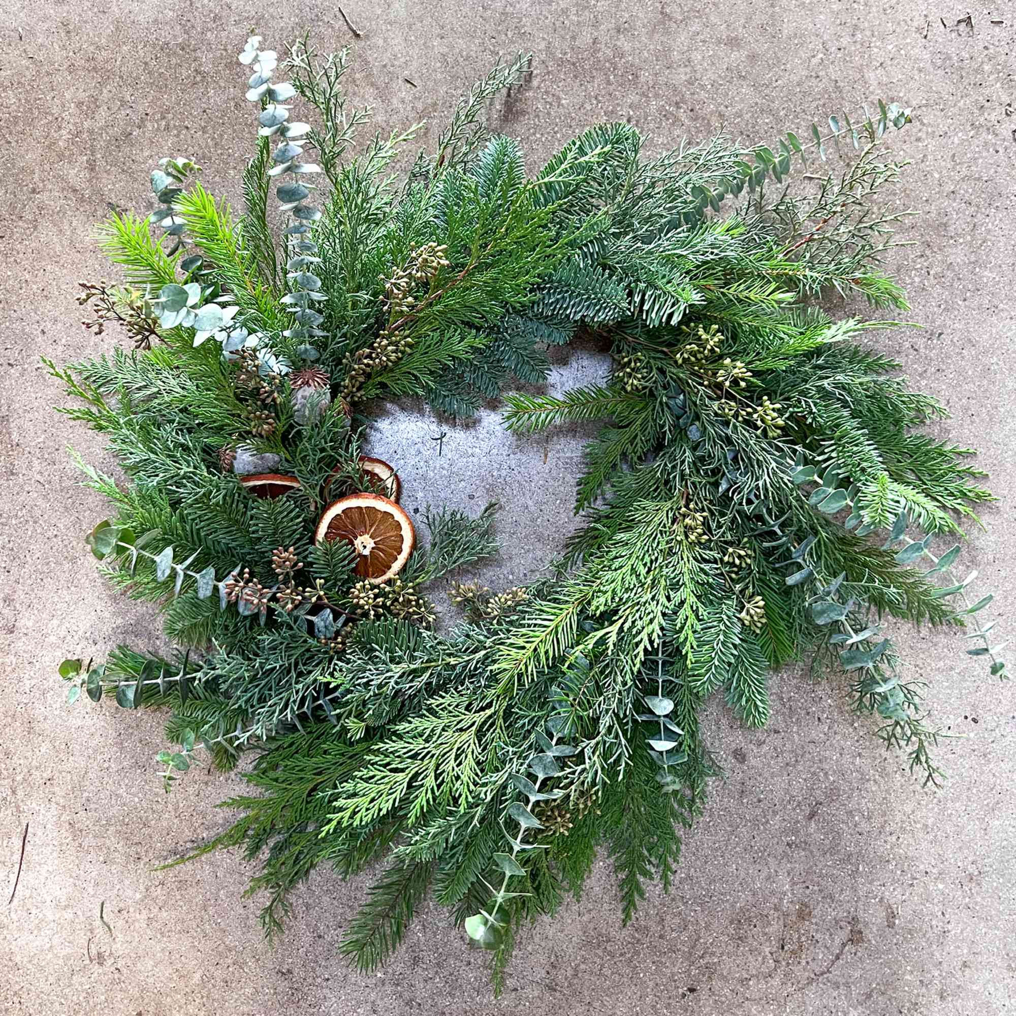 Our winter wreaths feature beautiful seasonal foliage, eucalyptus, dried bits and fruits.