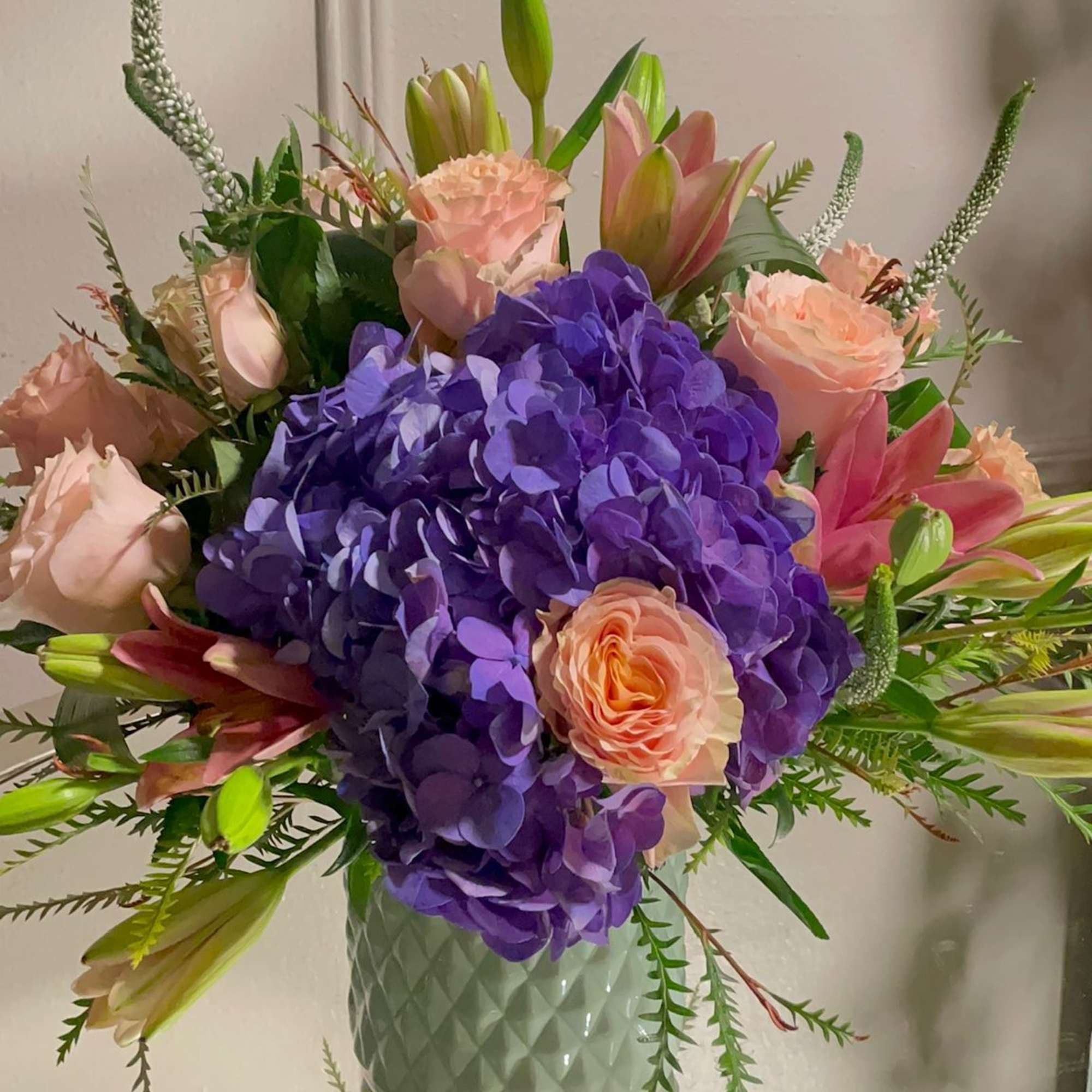 
Pretty pinks, luscious purple, peach petals gathered in a glamorous vase. Vases
