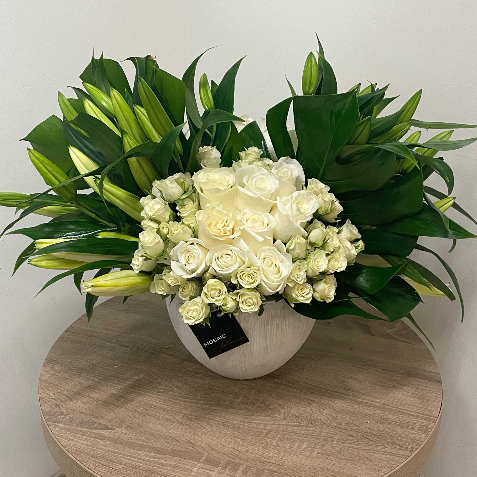 Make a statement with this grand and luxurious arrangement! Featuring an abundance Make a statement with this grand and luxurious arrangement! Featuring an abundance