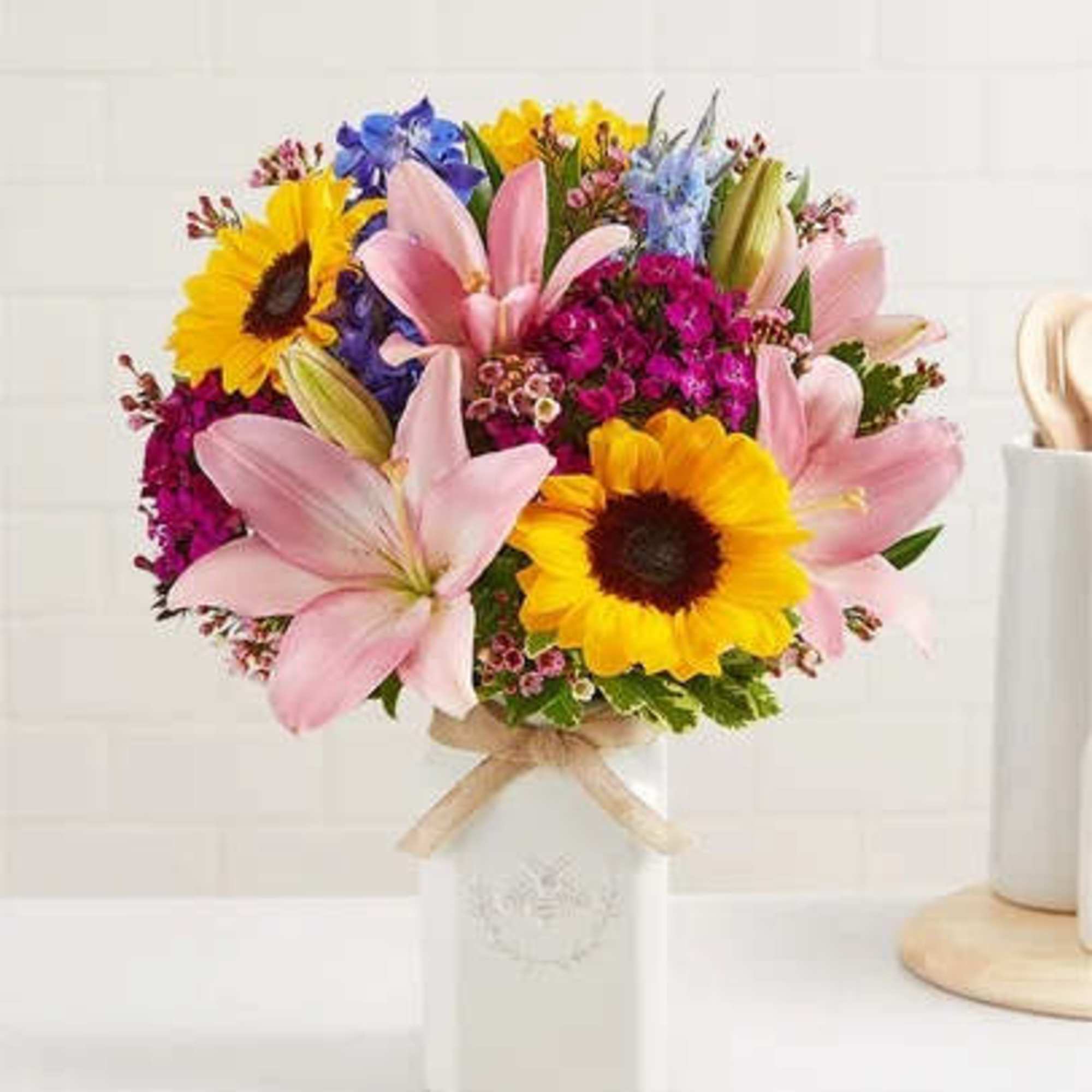 Get them buzzing with our charming bouquet! Sunflowers, Pink Asiatic Lily, Blue