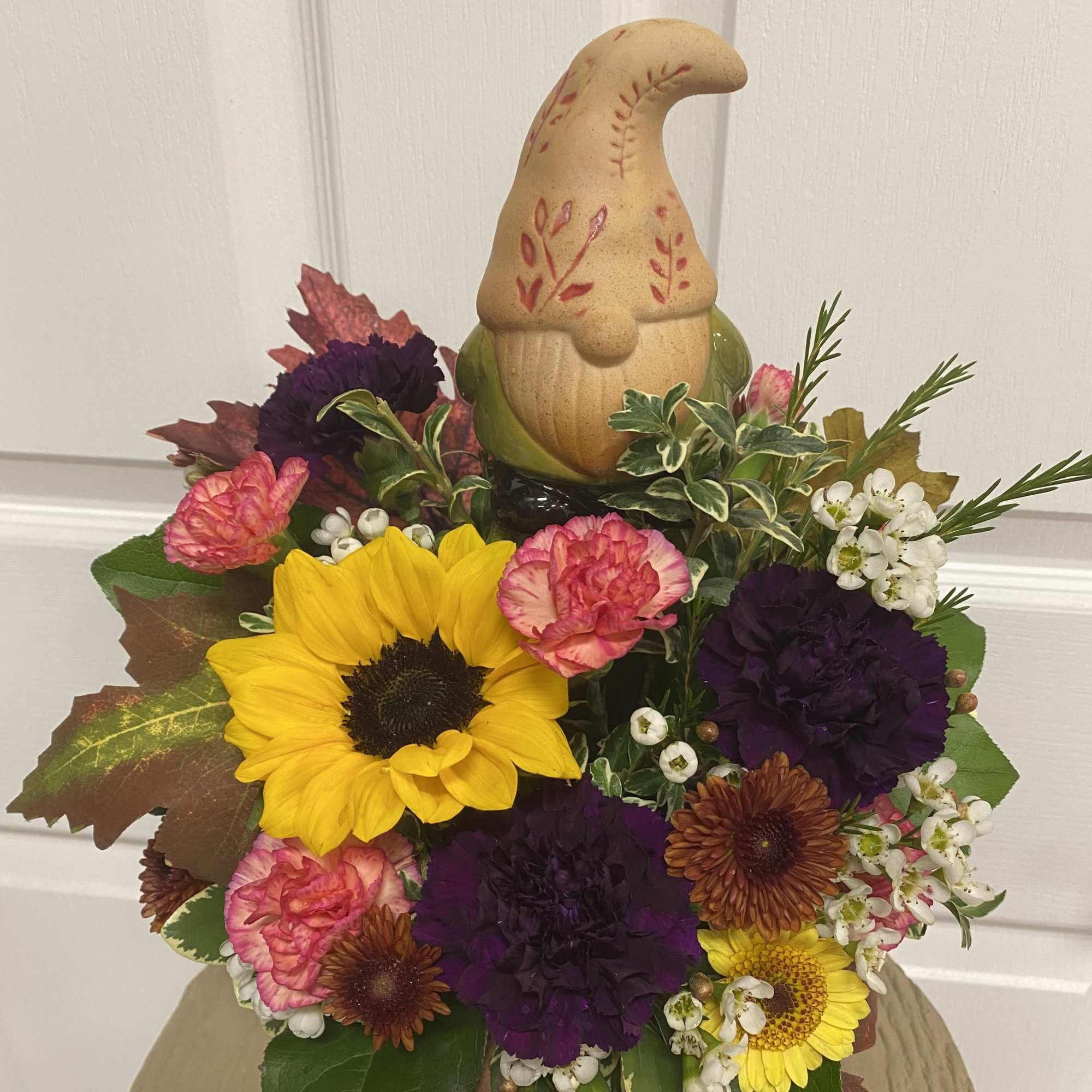 Get this arrangement for a gnome lover! Comes with a decorative bobblehead