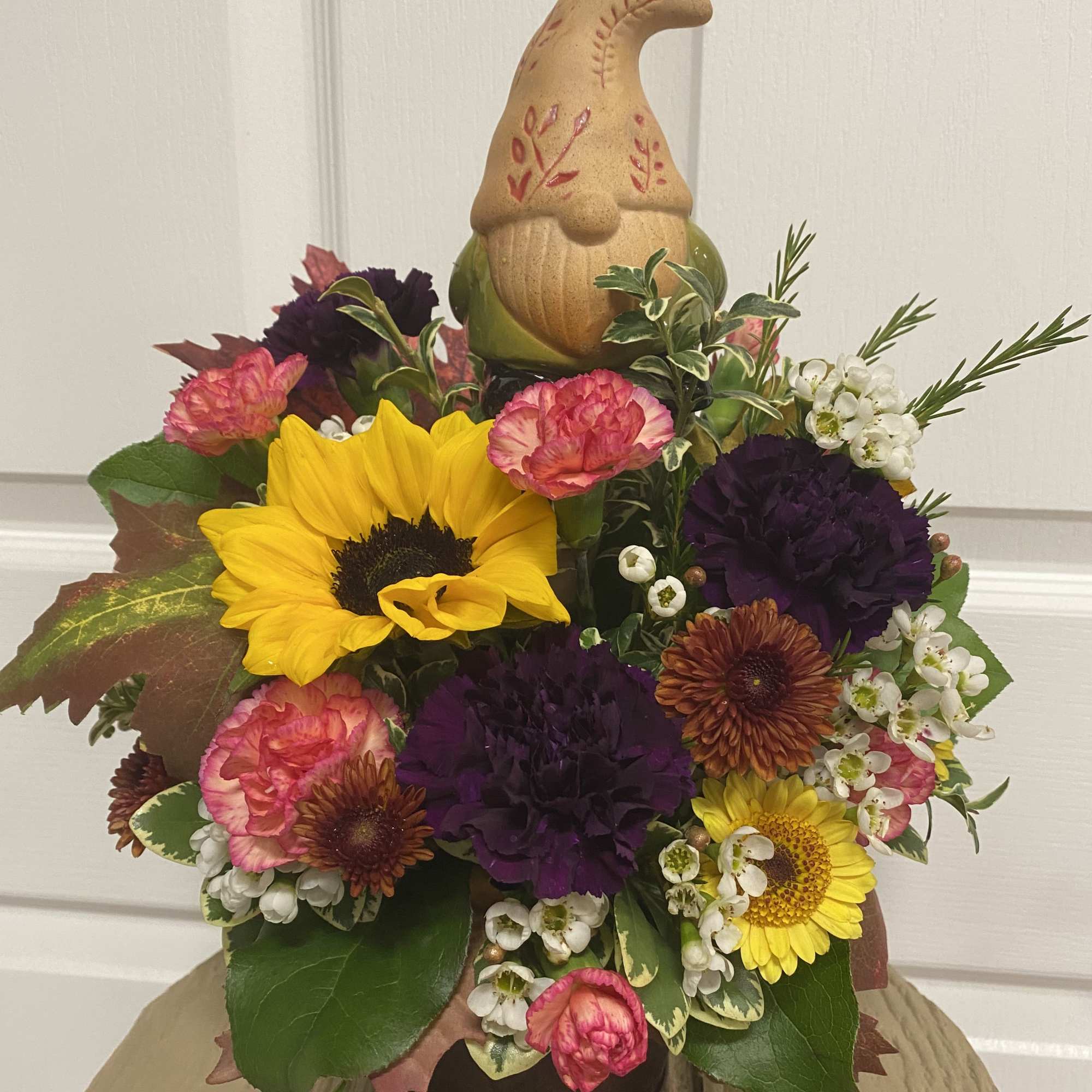 Get this arrangement for a gnome lover! Comes with a decorative bobblehead