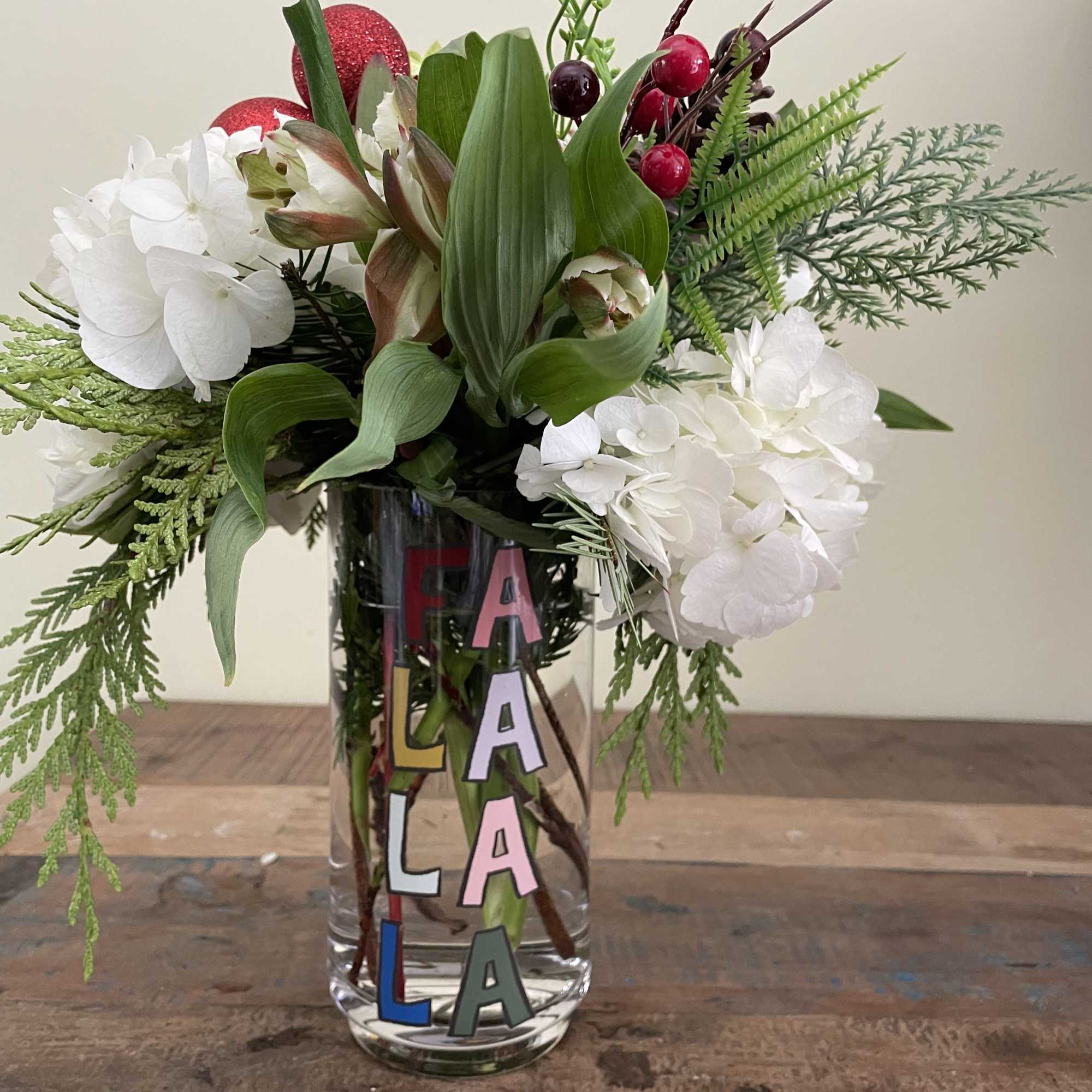 White and green hydrangea, white alstro, berries and cones.  White and green hydrangea, white alstro, berries and cones.