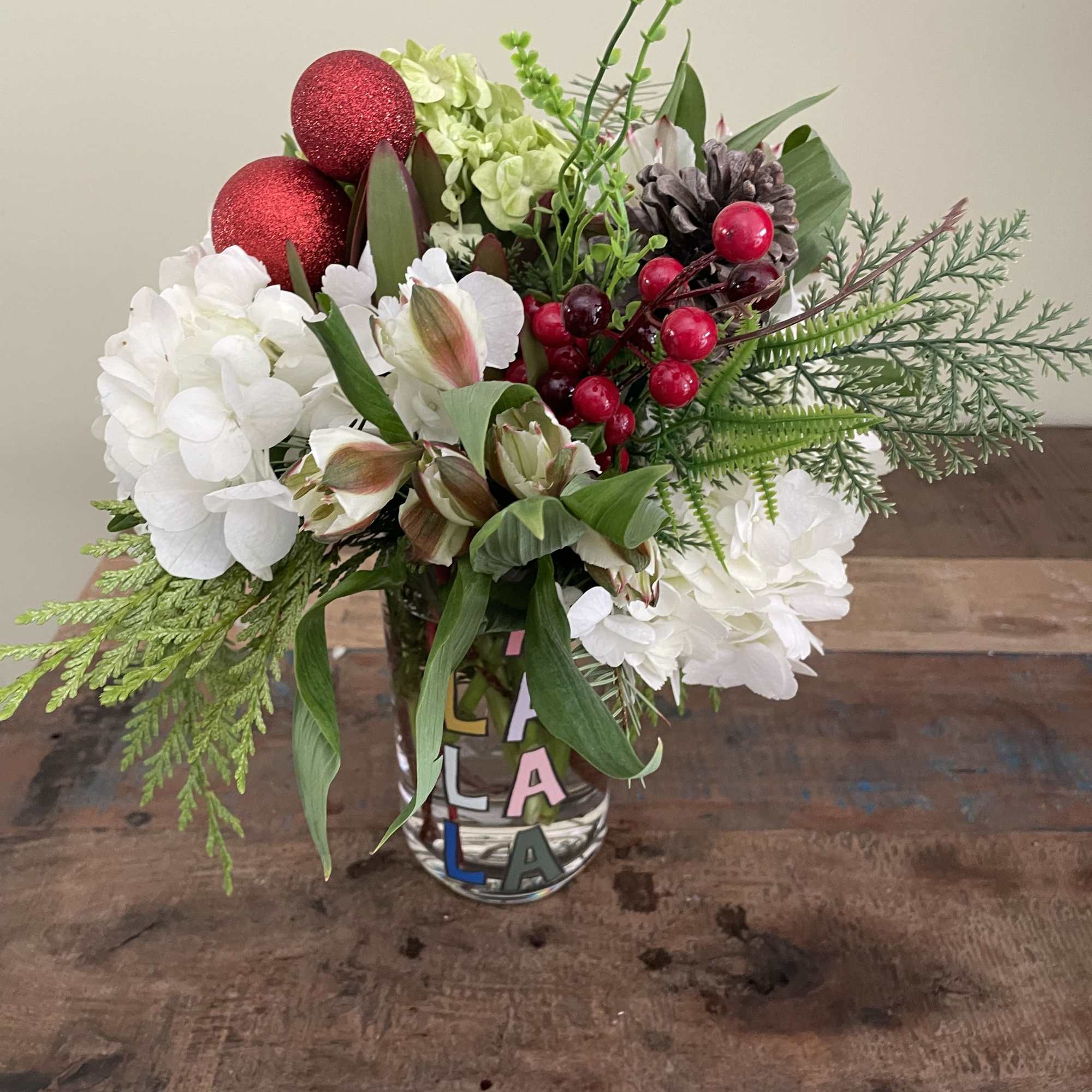 White and green hydrangea, white alstro, berries and cones.  White and green hydrangea, white alstro, berries and cones.