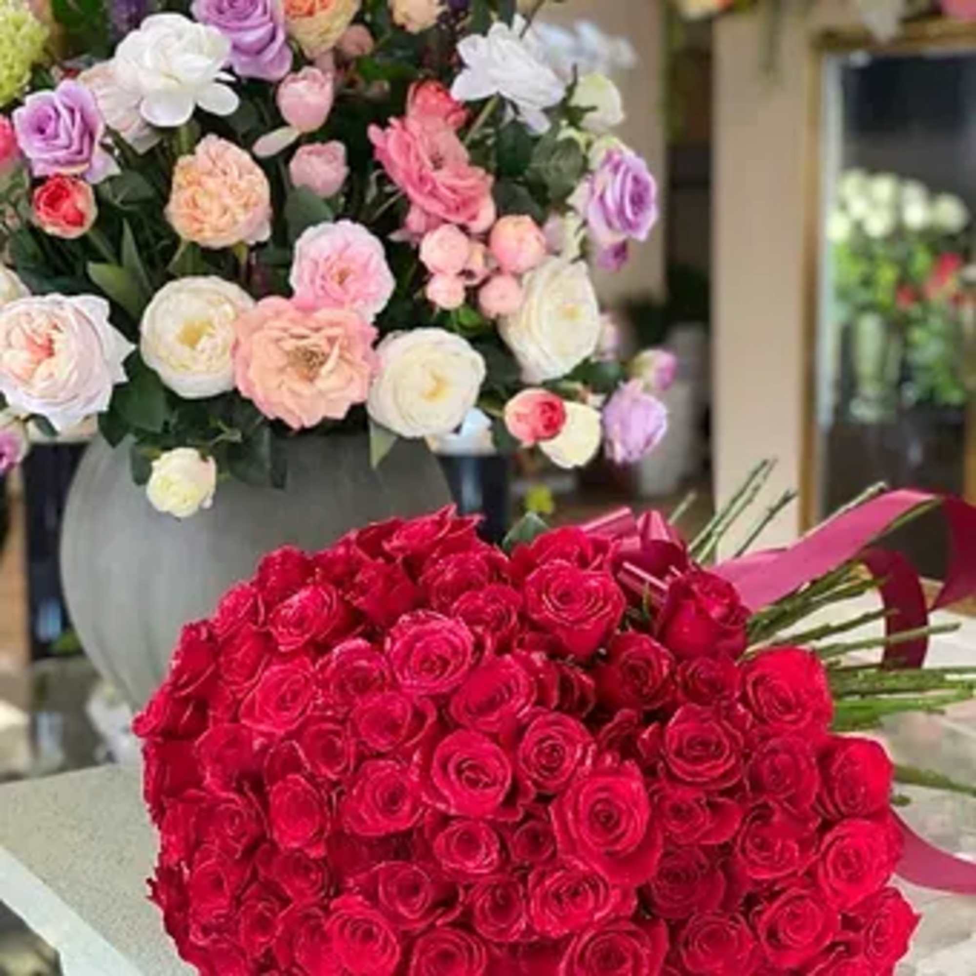 Send all your love with a beautiful mounded display of red roses.