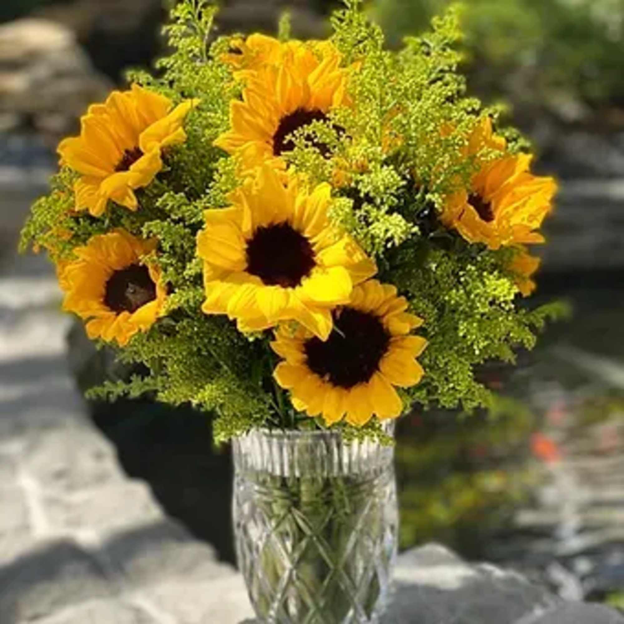 Order a bright bouquet of sunflowers in a stylish vase - we