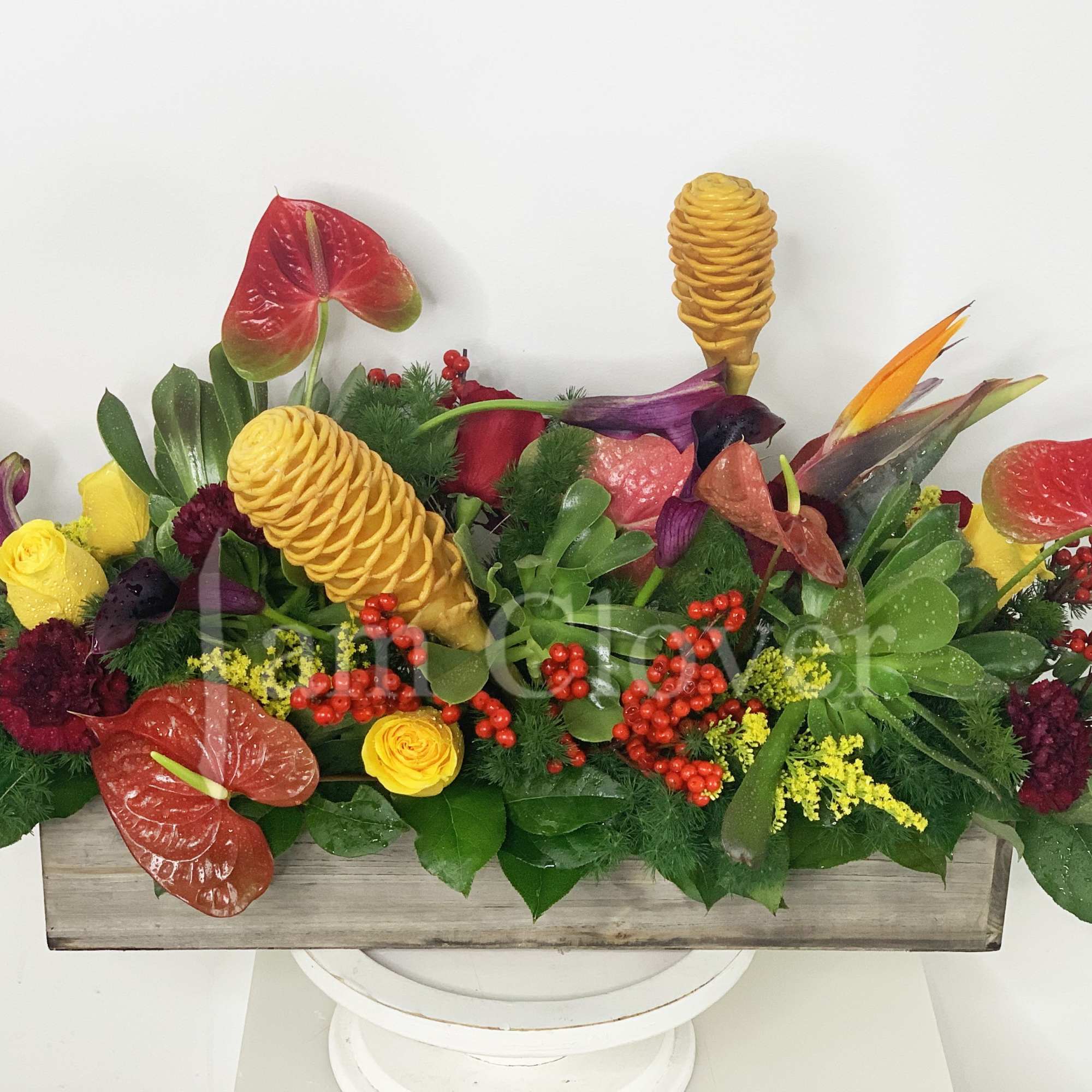 This basket combines the warm richness of burgundy and bursts of yellow