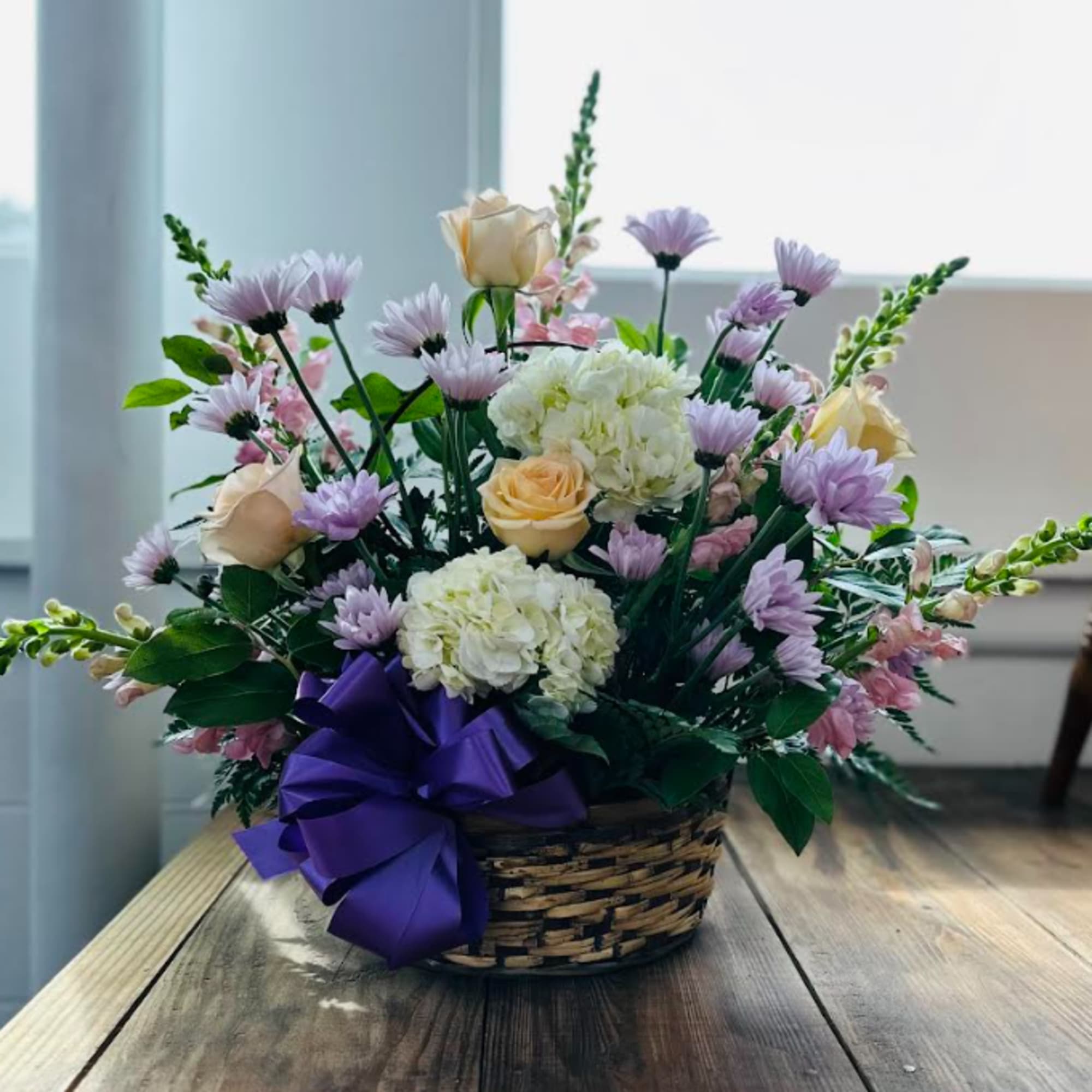 Beautiful collection of Daisies, Roses, Snapdragons, Hydrangeas and mixed greens in a