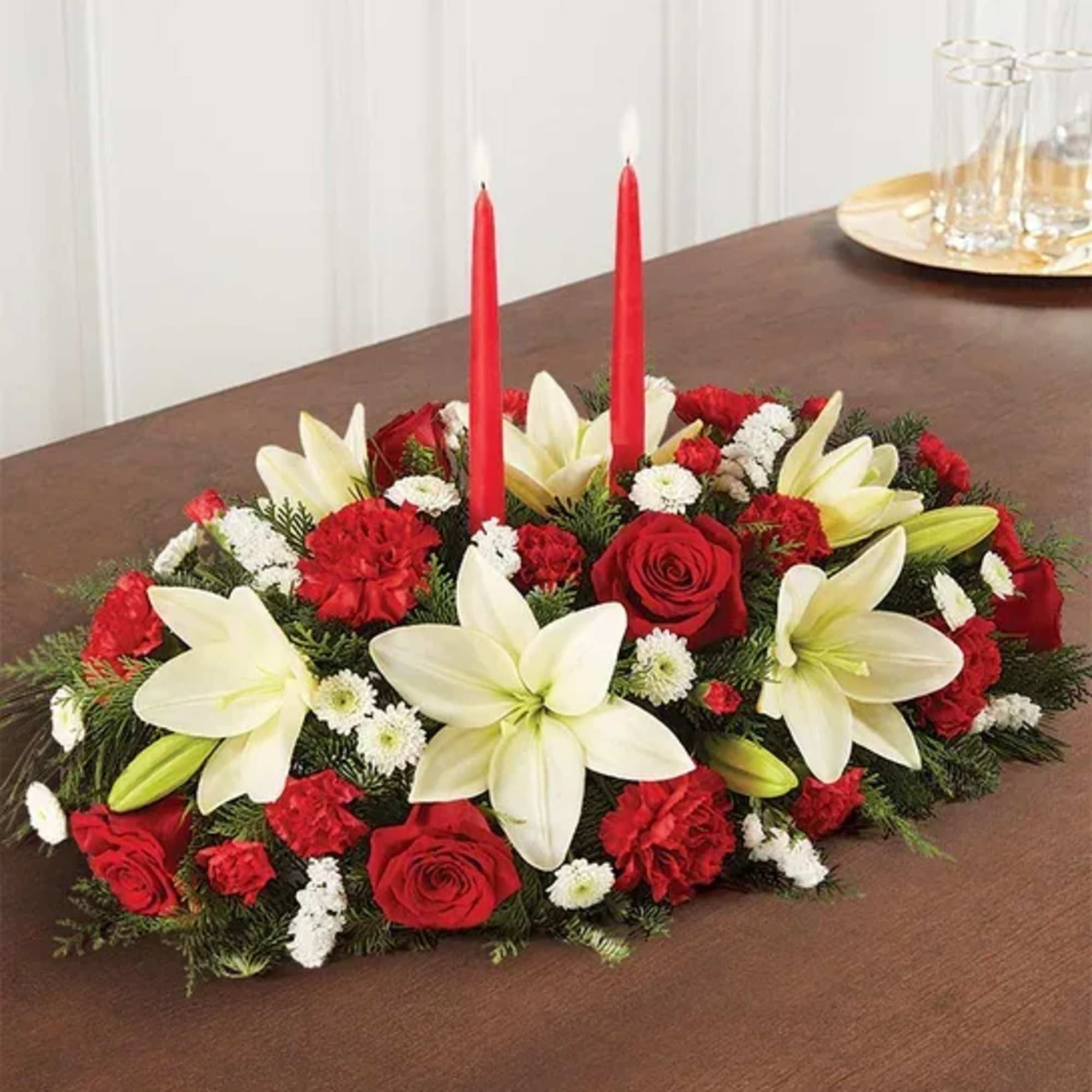 Our traditional table arrangement creates the perfect centerpiece for your Christmas celebration.