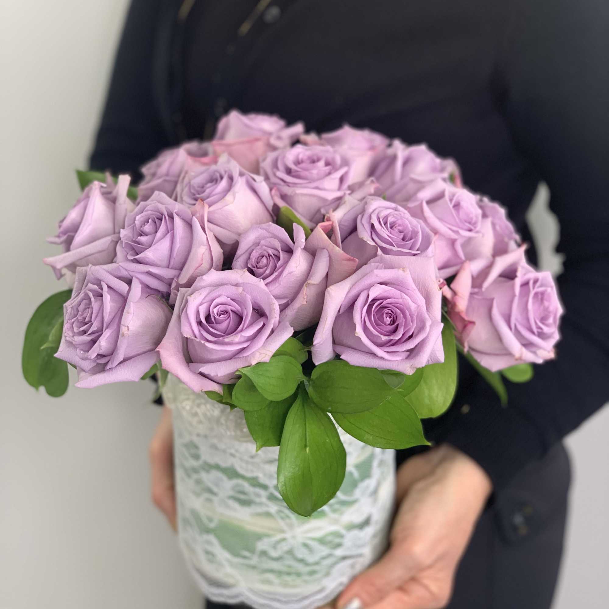 These lavender roses are stunning arranged in a cylinder vase for your