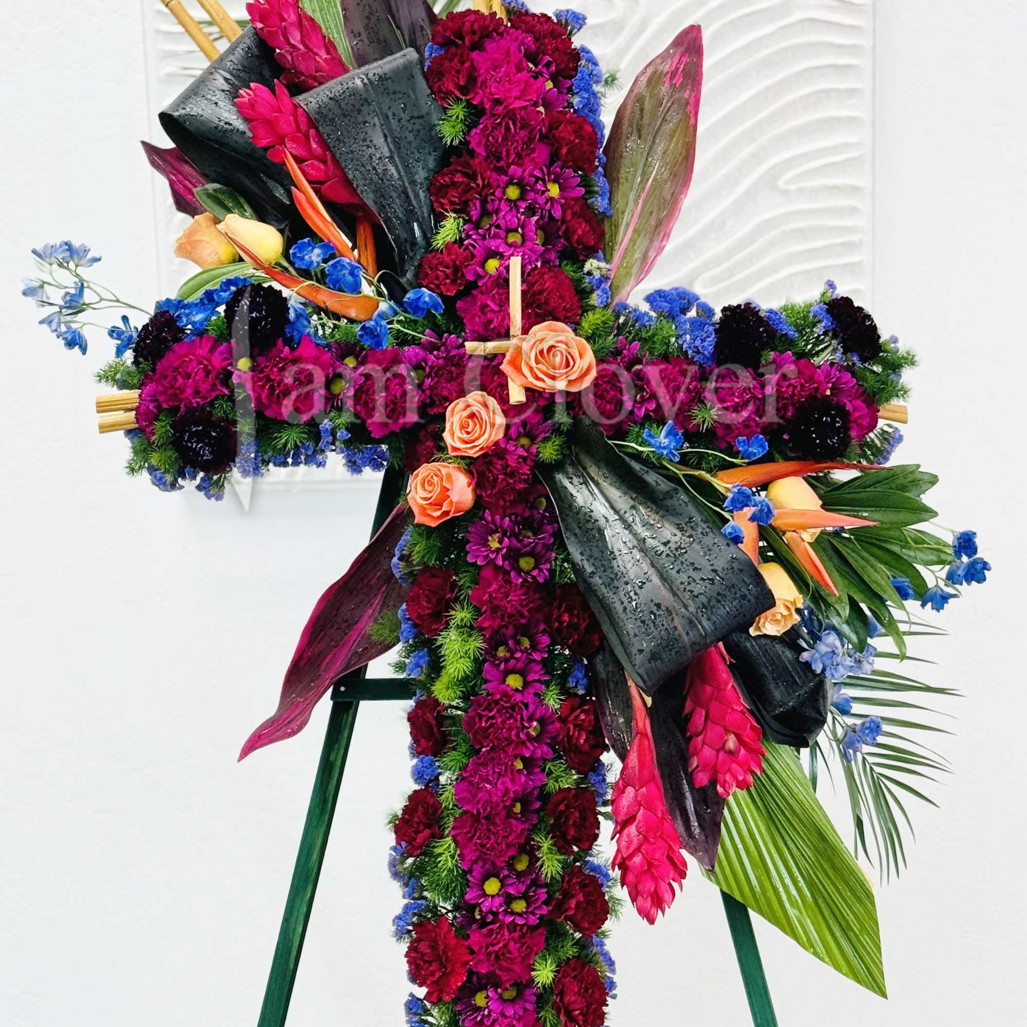 A beautiful tropical flower standing cross is a vibrant and striking tribute.
Fulfill