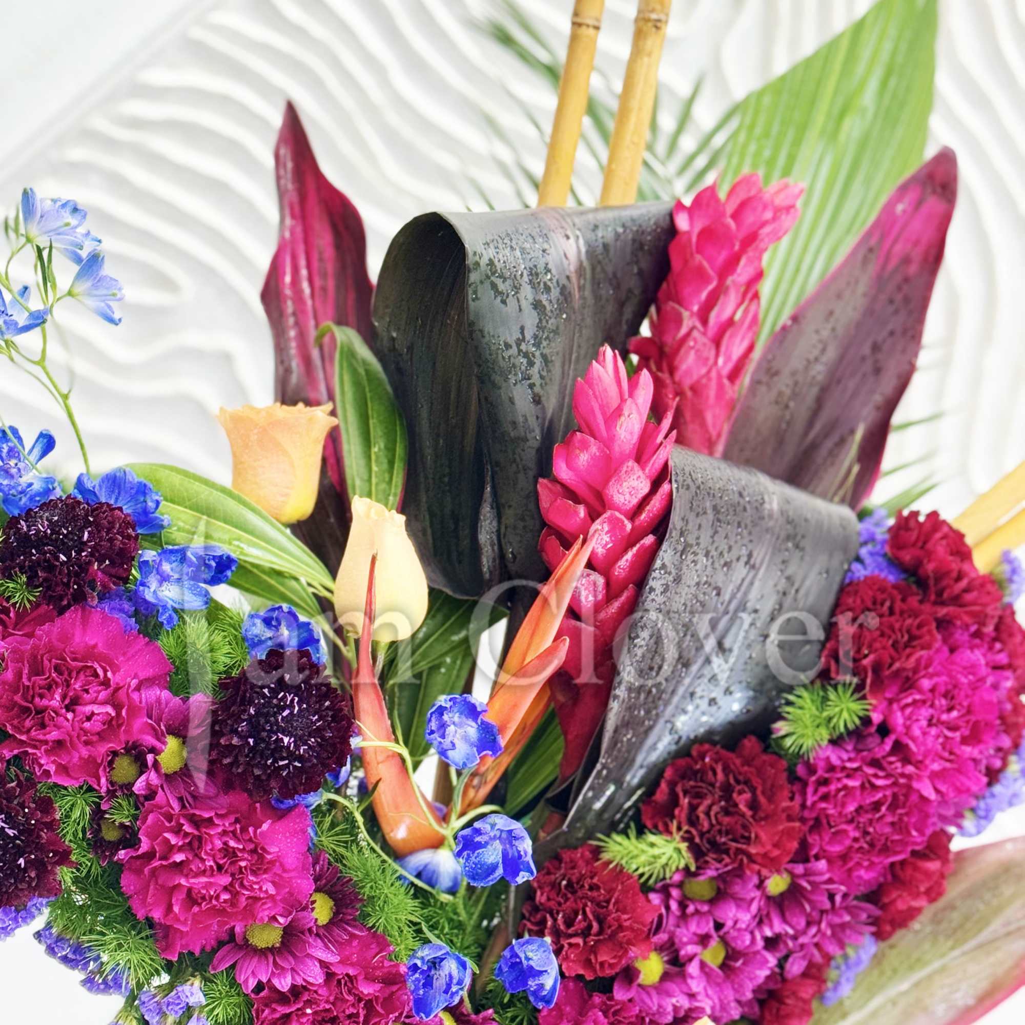 A beautiful tropical flower standing cross is a vibrant and striking tribute.
Fulfill