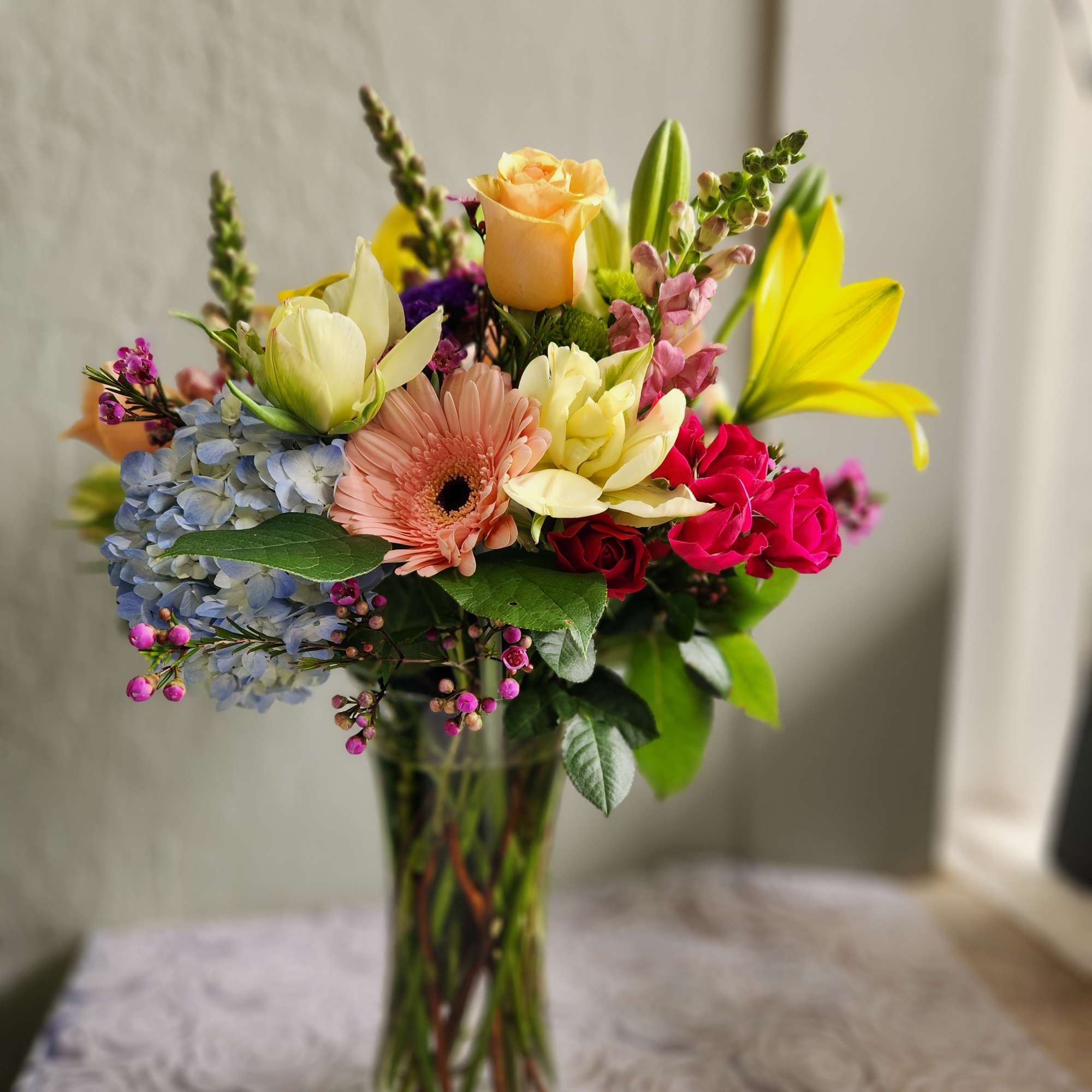 A beautiful mix of in season blooms.  This arrangement is about