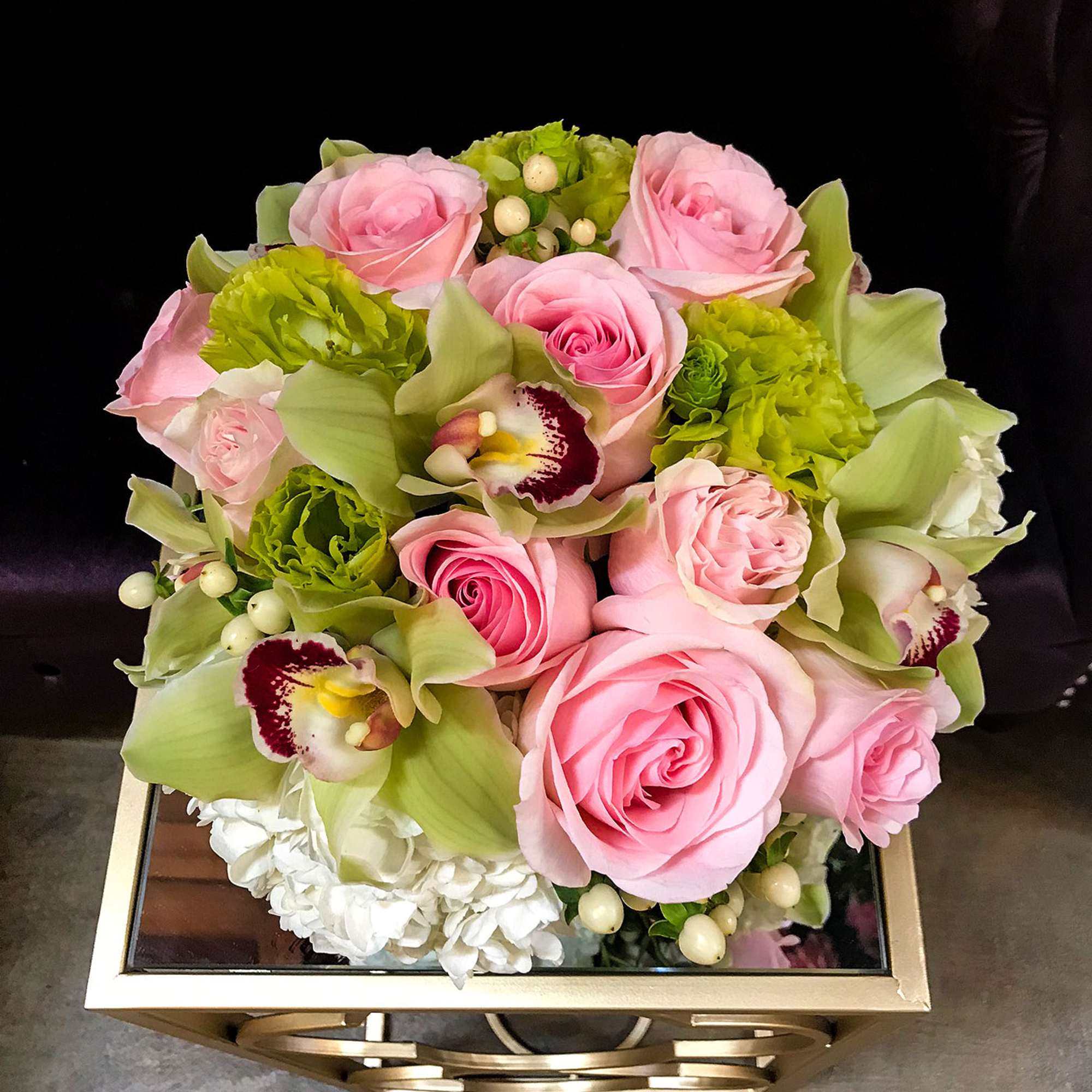 Impress your special someone with this collection of white hydrangeas, pink roses