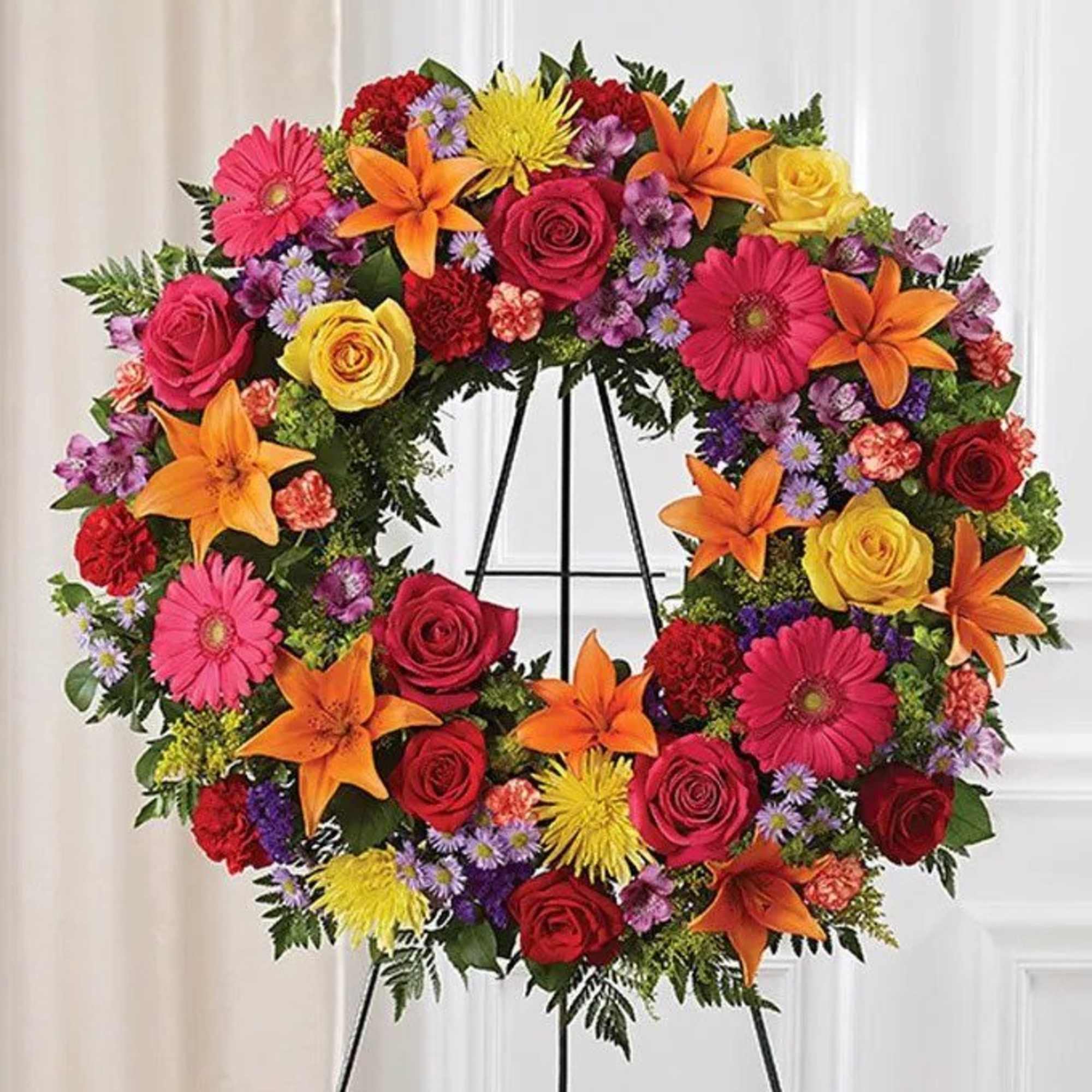 Bright &amp; vibrant colors stand out on this open wreath. Easel included.