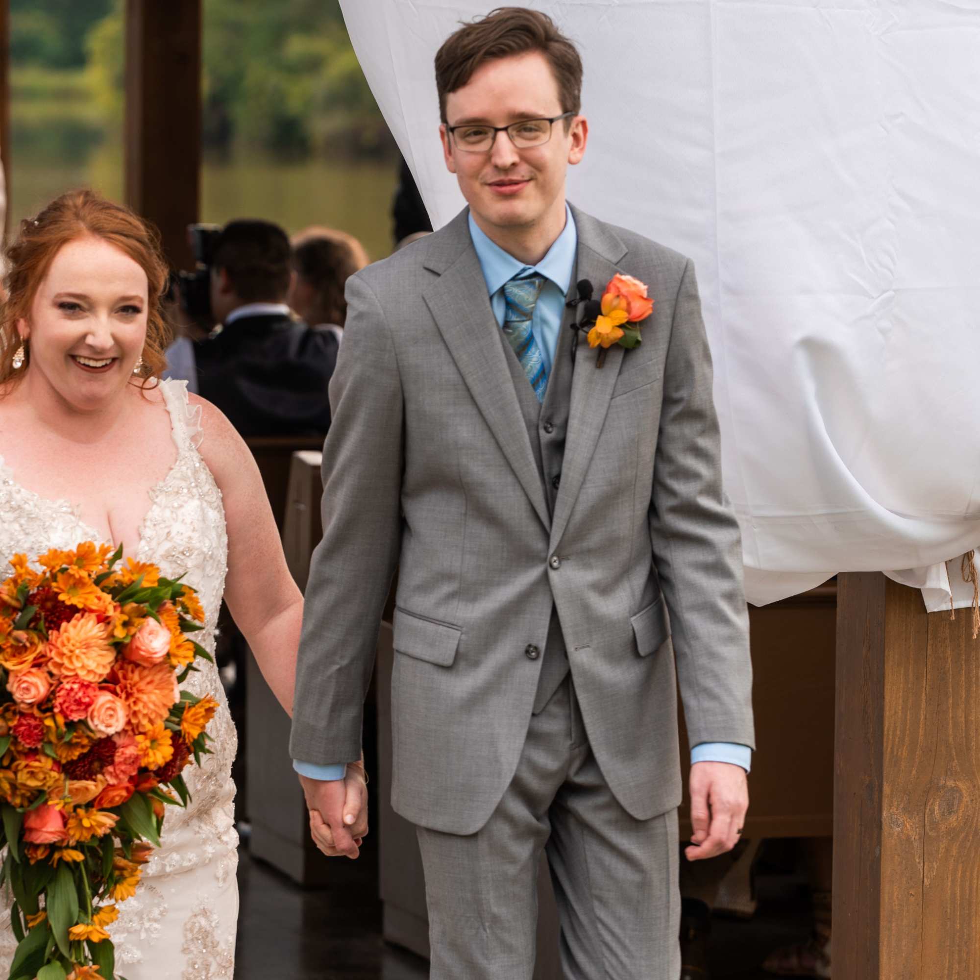 Beautiful reach  orange sunset color bridal cascade with roses, dahlias, carnations