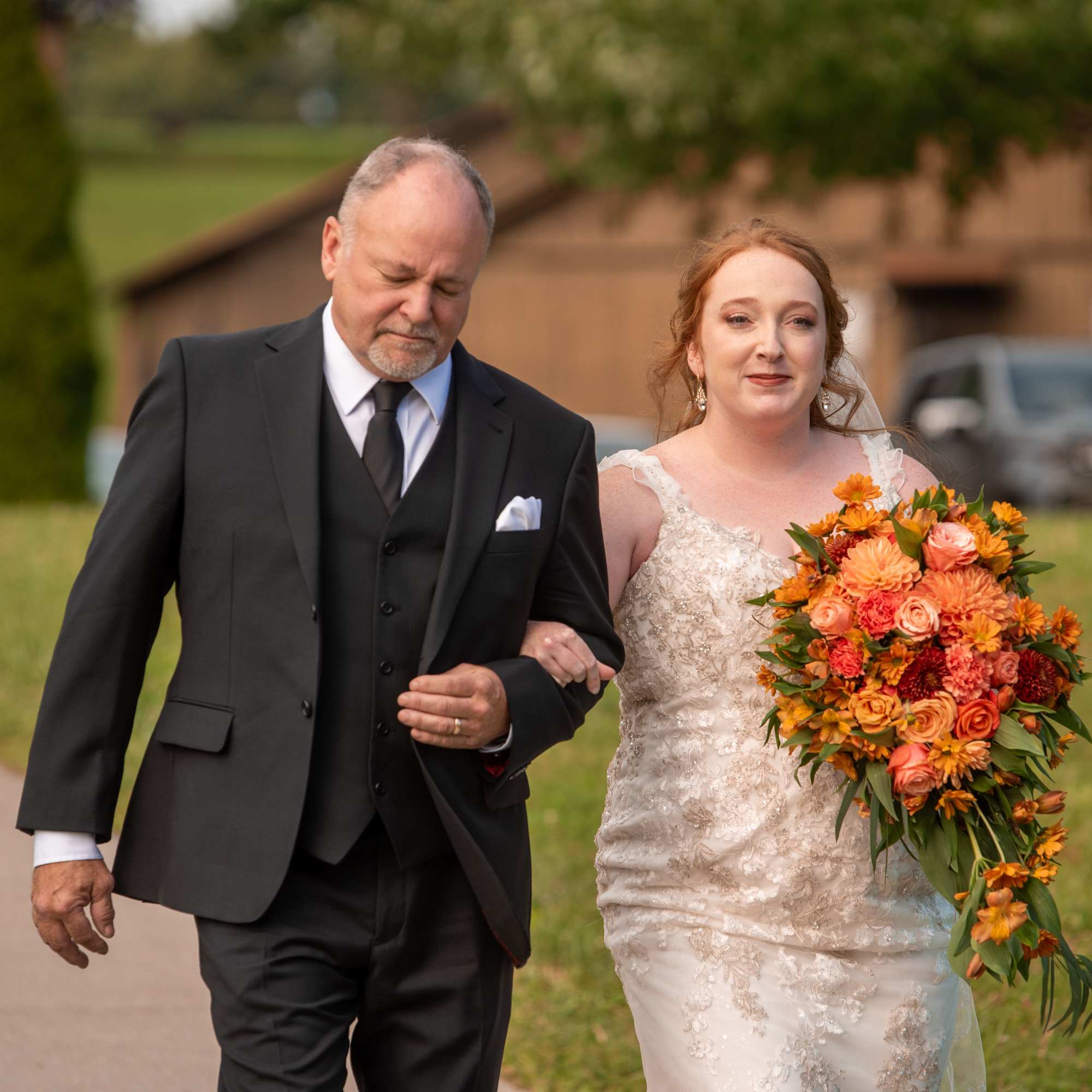 Beautiful reach  orange sunset color bridal cascade with roses, dahlias, carnations