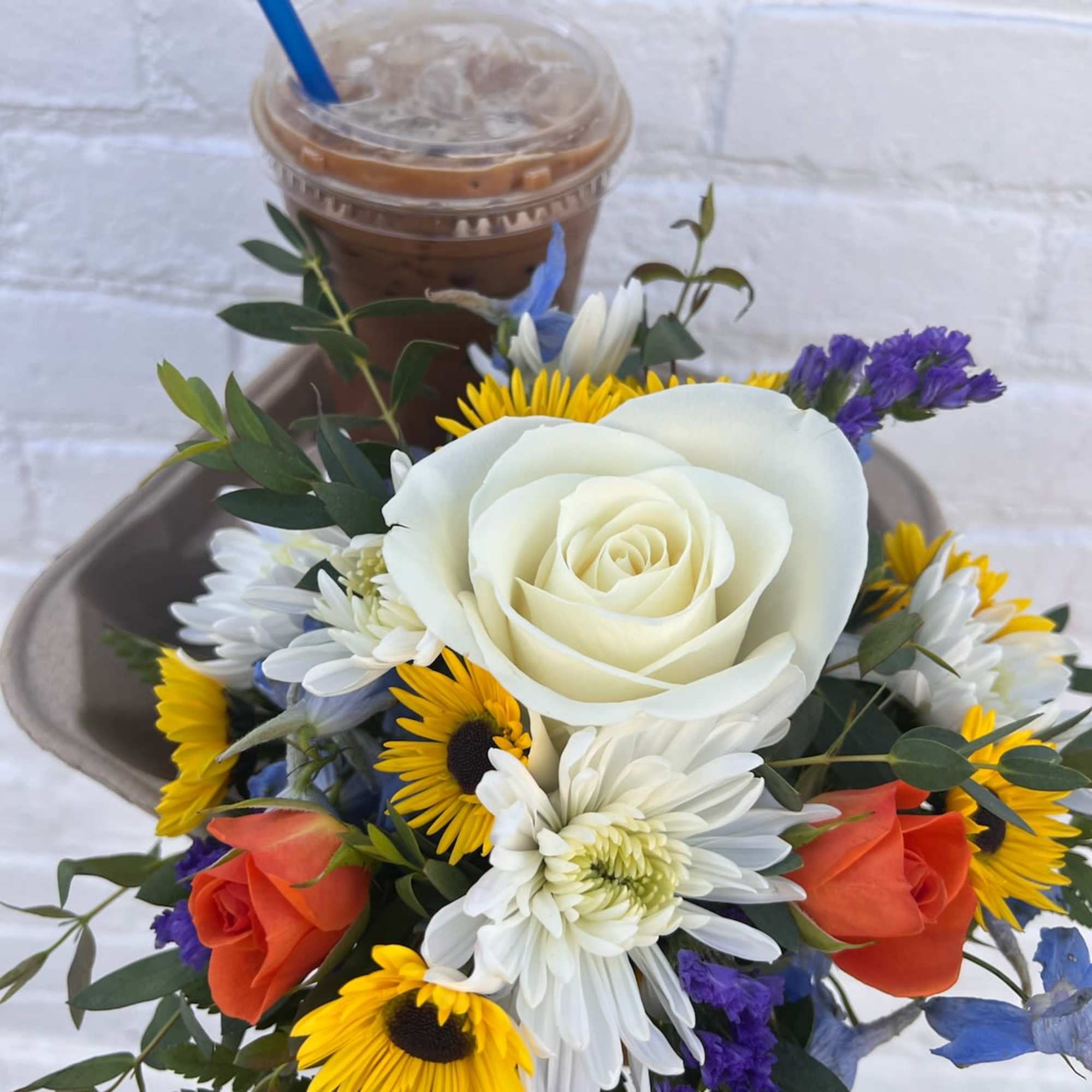 Send a friend a coffee and flowers! 
If a drink order is