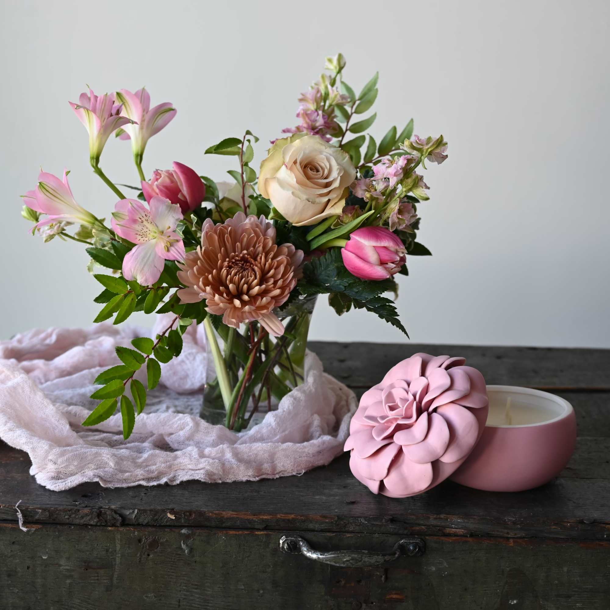Our mason jar holds a simple, but lovely bouquet of seasonal flowers.