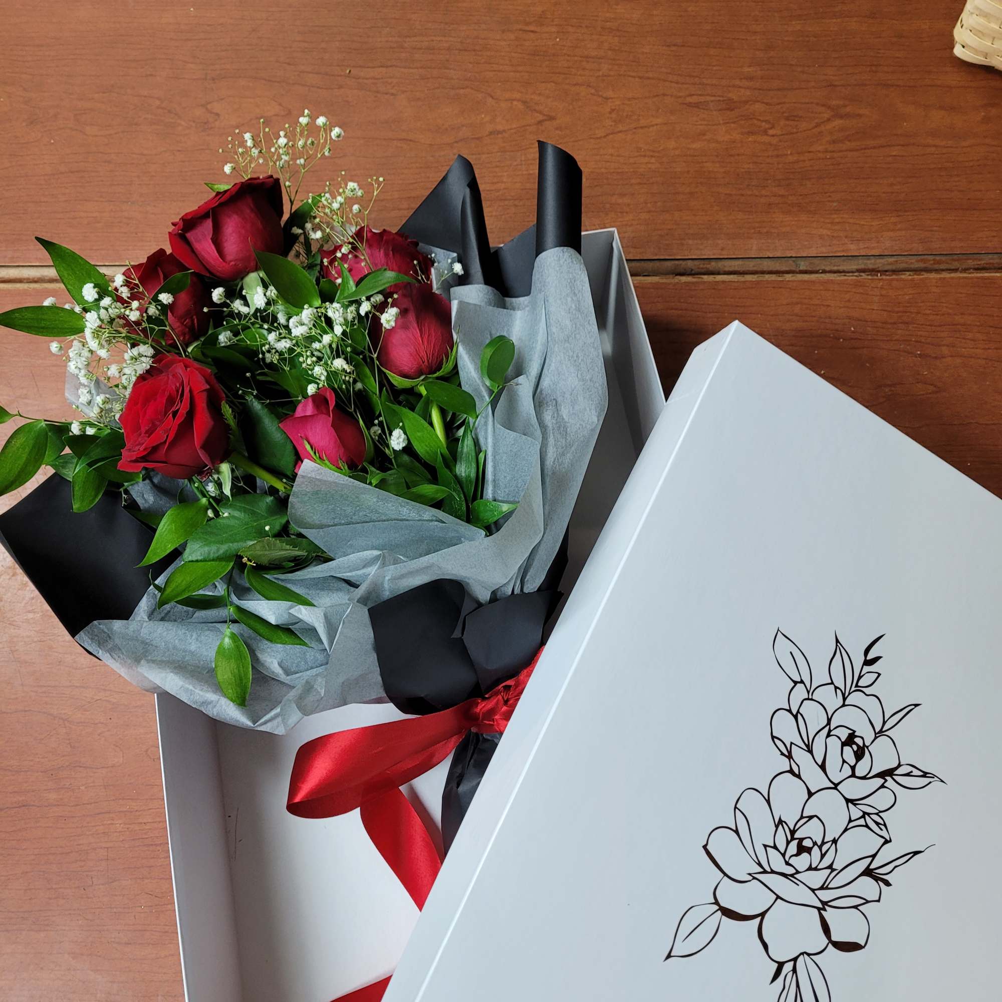 a collection of seasonally available blooms wrapped in our specialty wrapping and