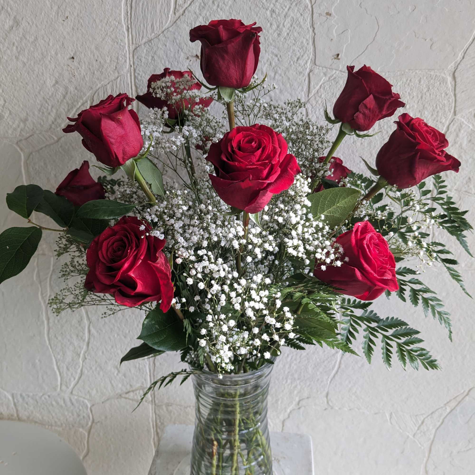 These dozen red roses with baby&#039;s breath are classic! Perfect romantic gift