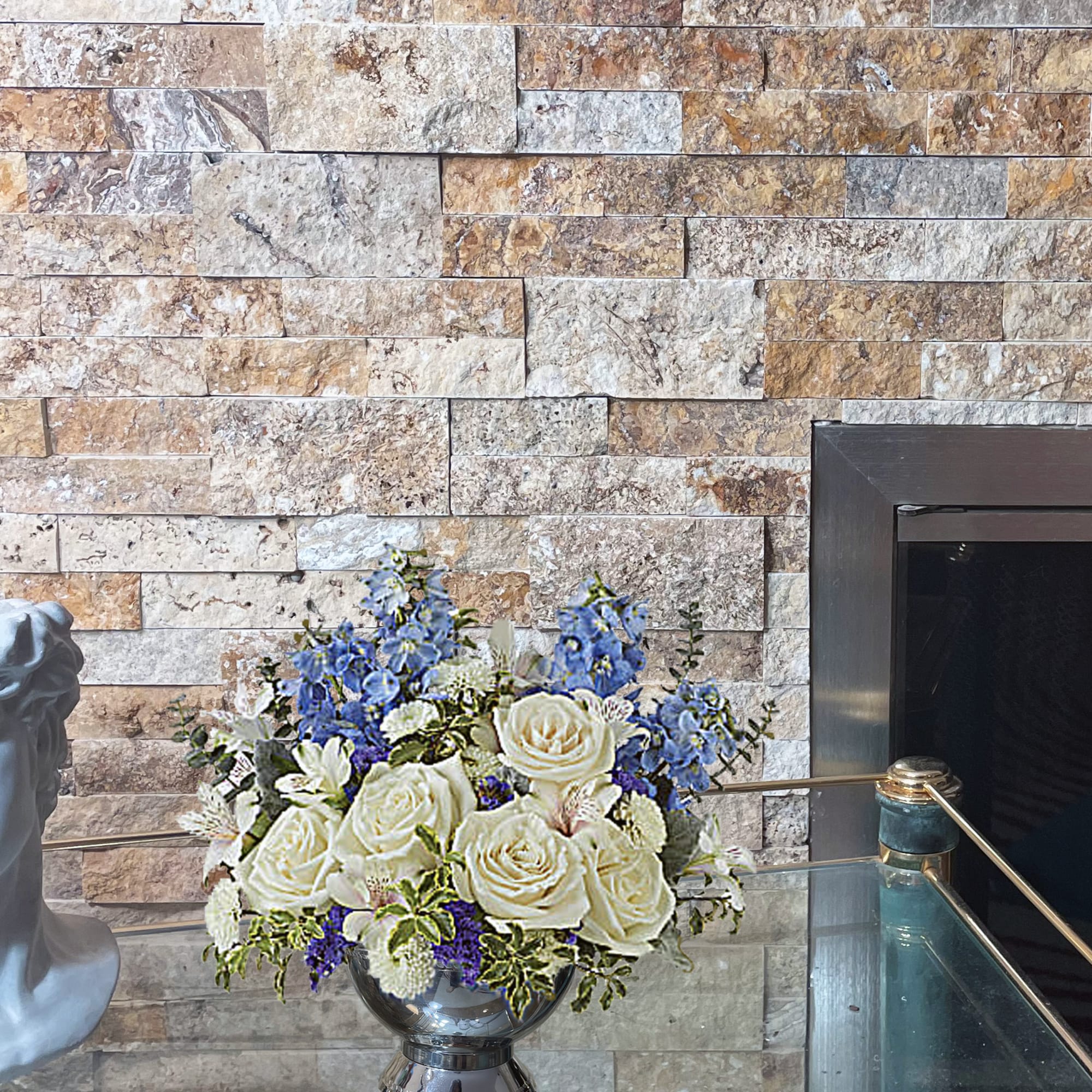 Like gazing into a clear blue sky, this serene arrangement soothes the