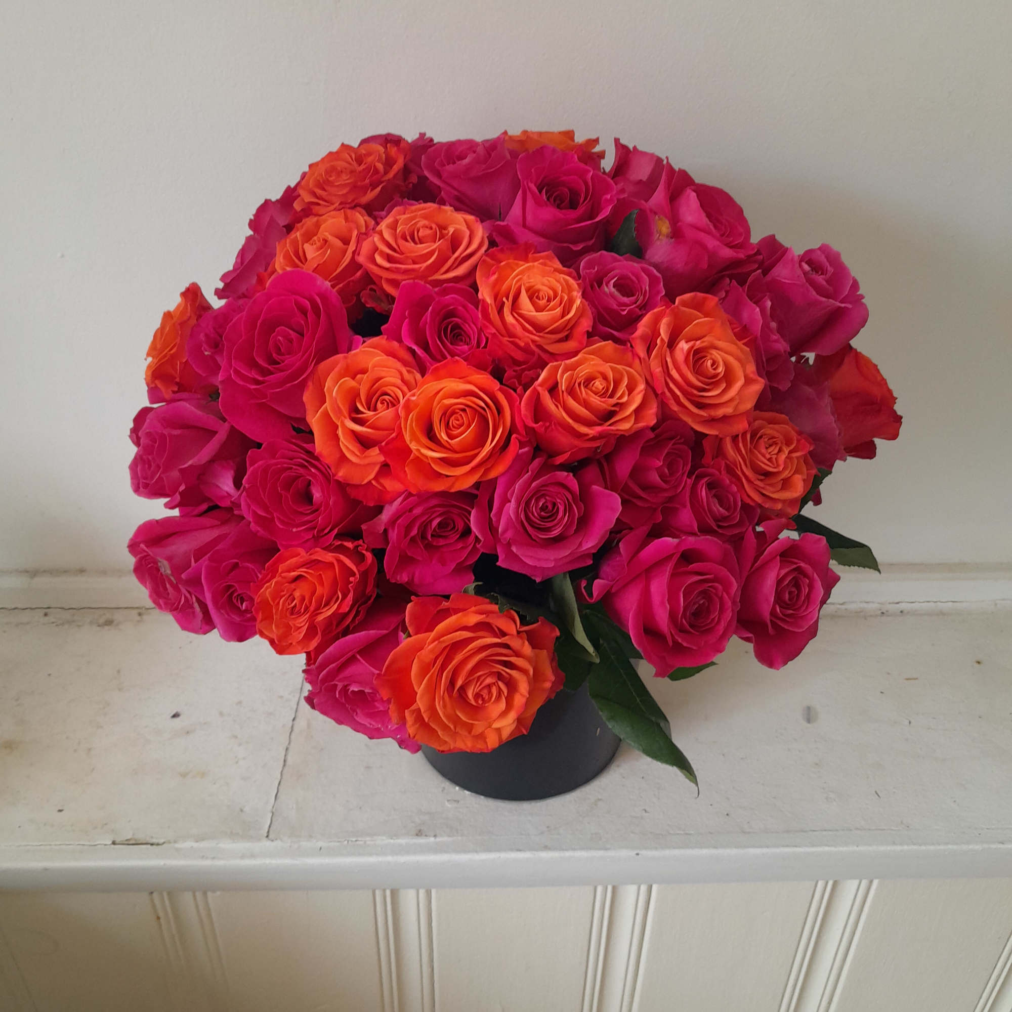 Beautiful hot pink Pink Floid roses mixed with some orange roses in