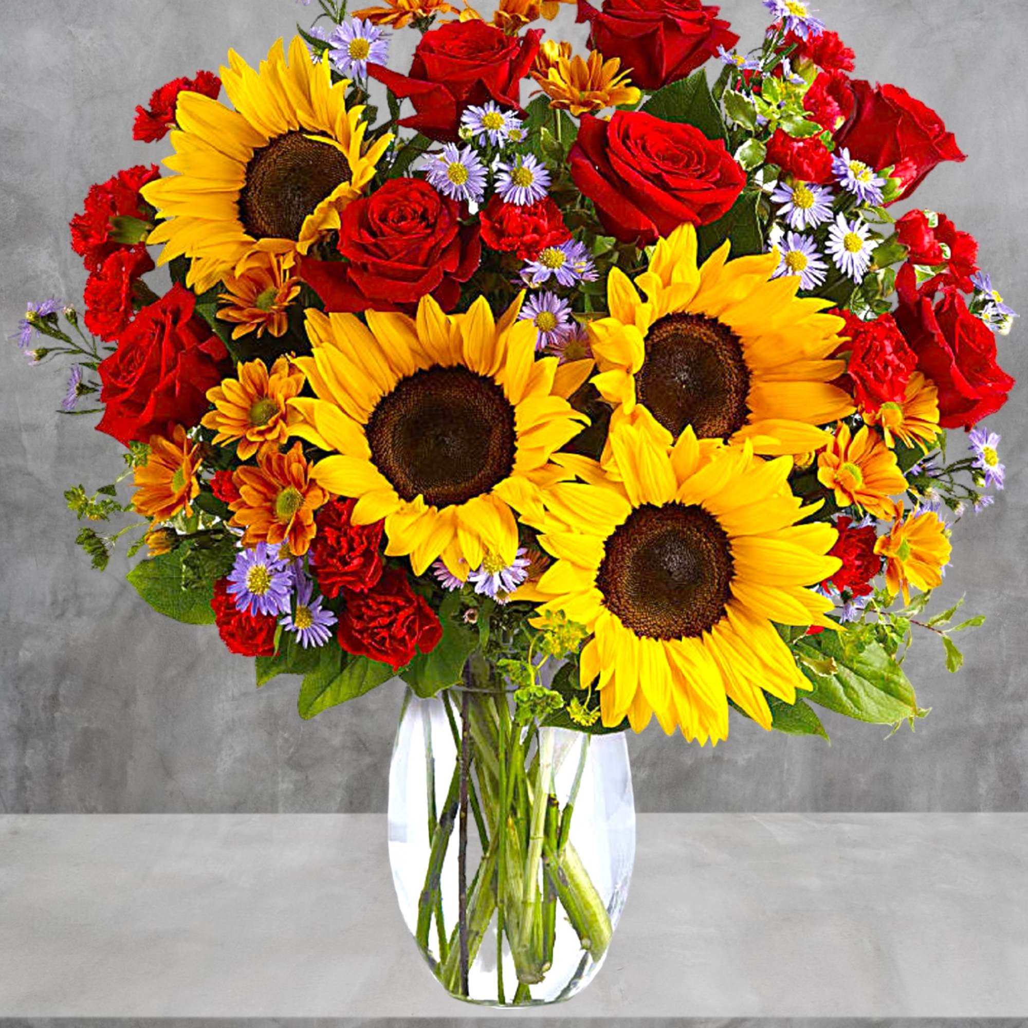 A sunny sunflower arrangement gets an autumnal spin with the addition of