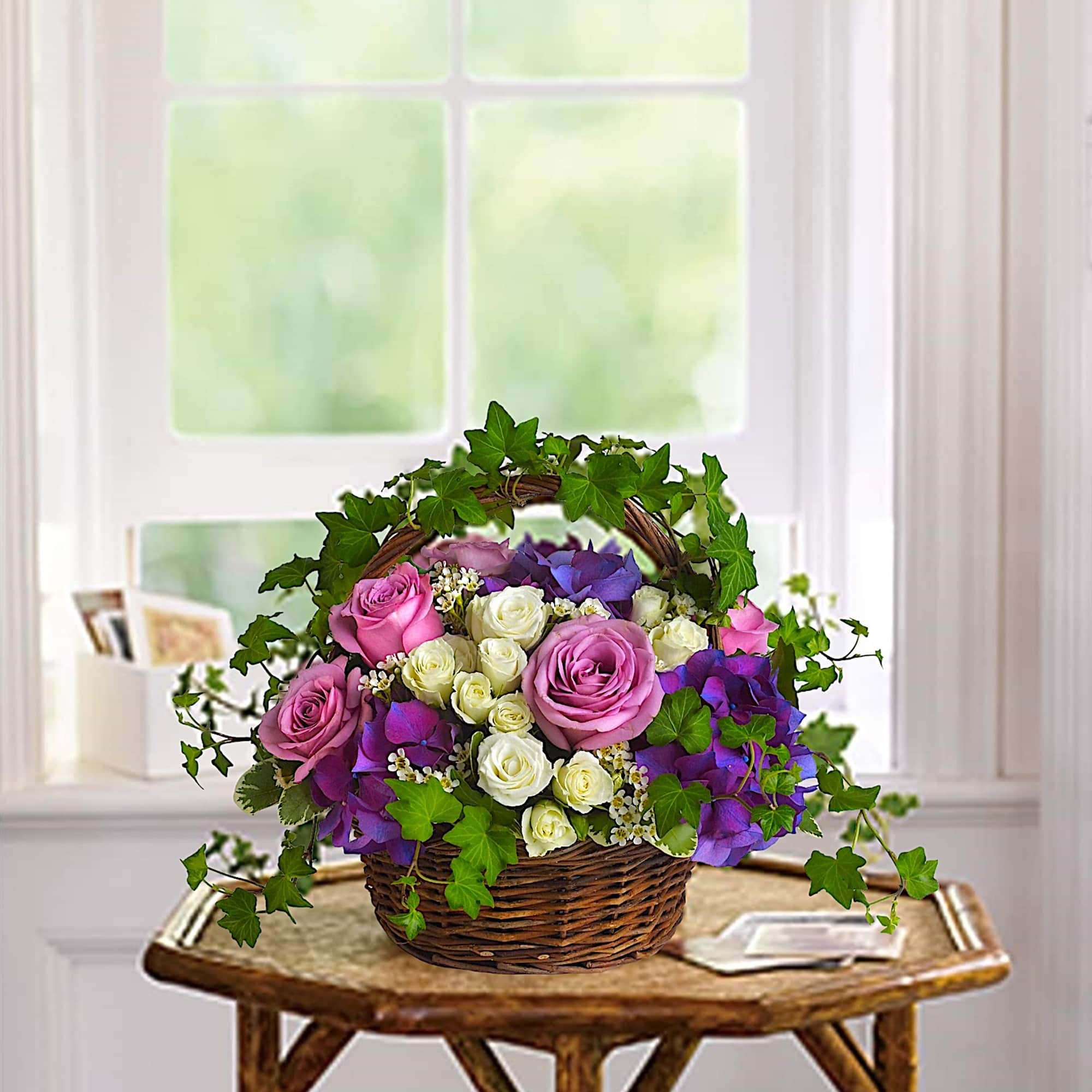 Lush flowers to celebrate a full life. This beautiful basket of flowers