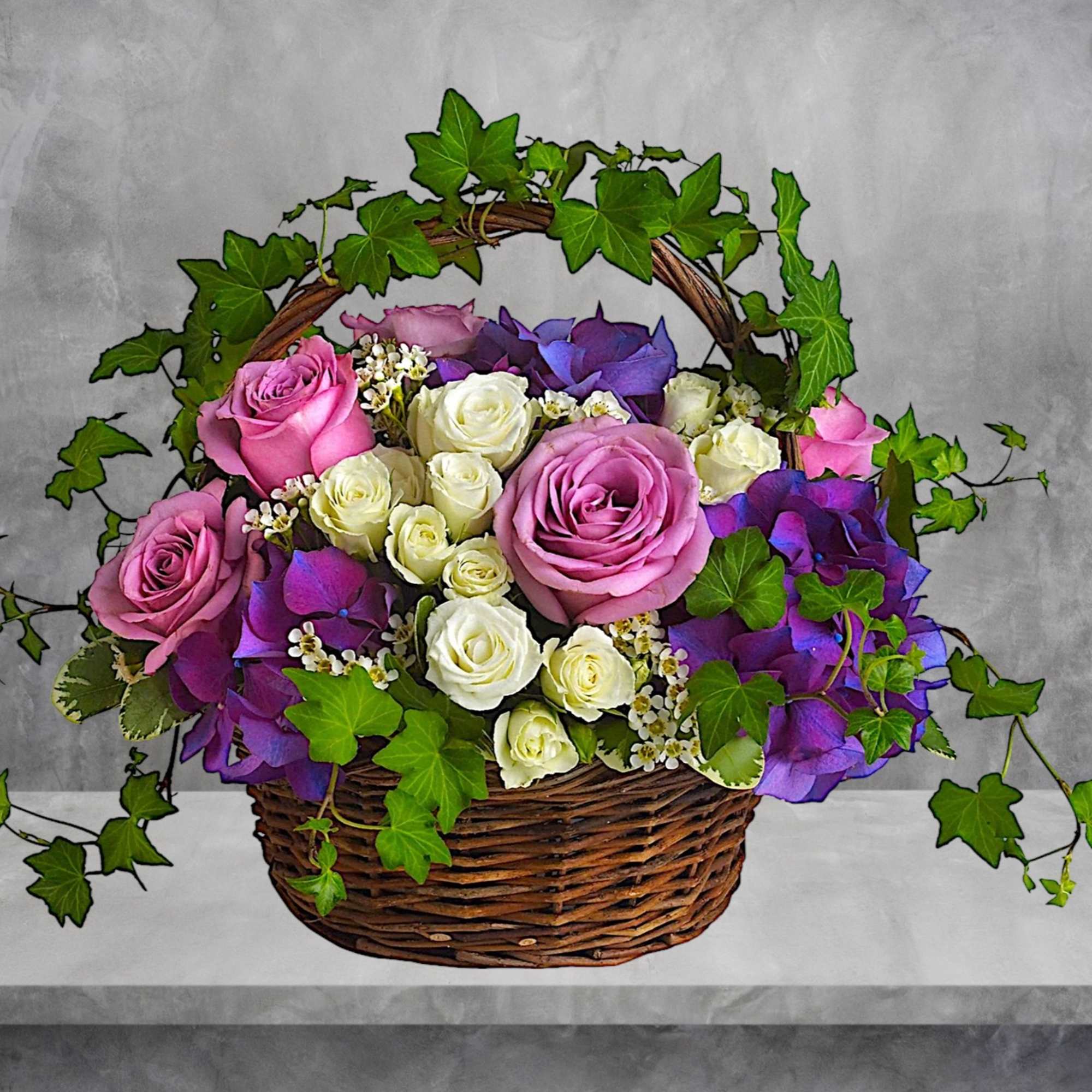 Lush flowers to celebrate a full life. This beautiful basket of flowers