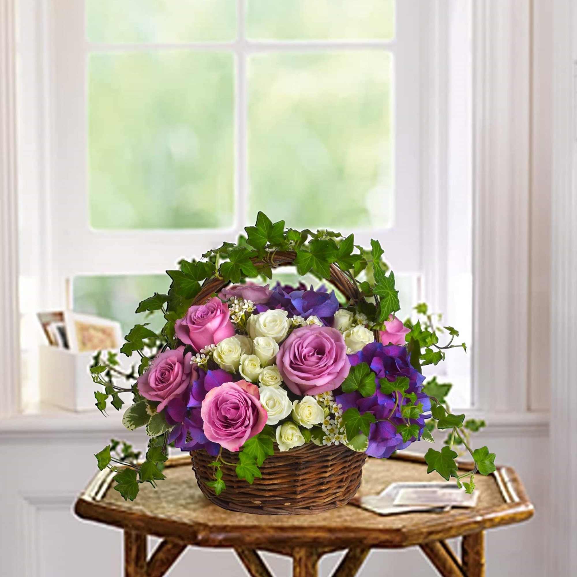 Lush flowers to celebrate a full life. This beautiful basket of flowers