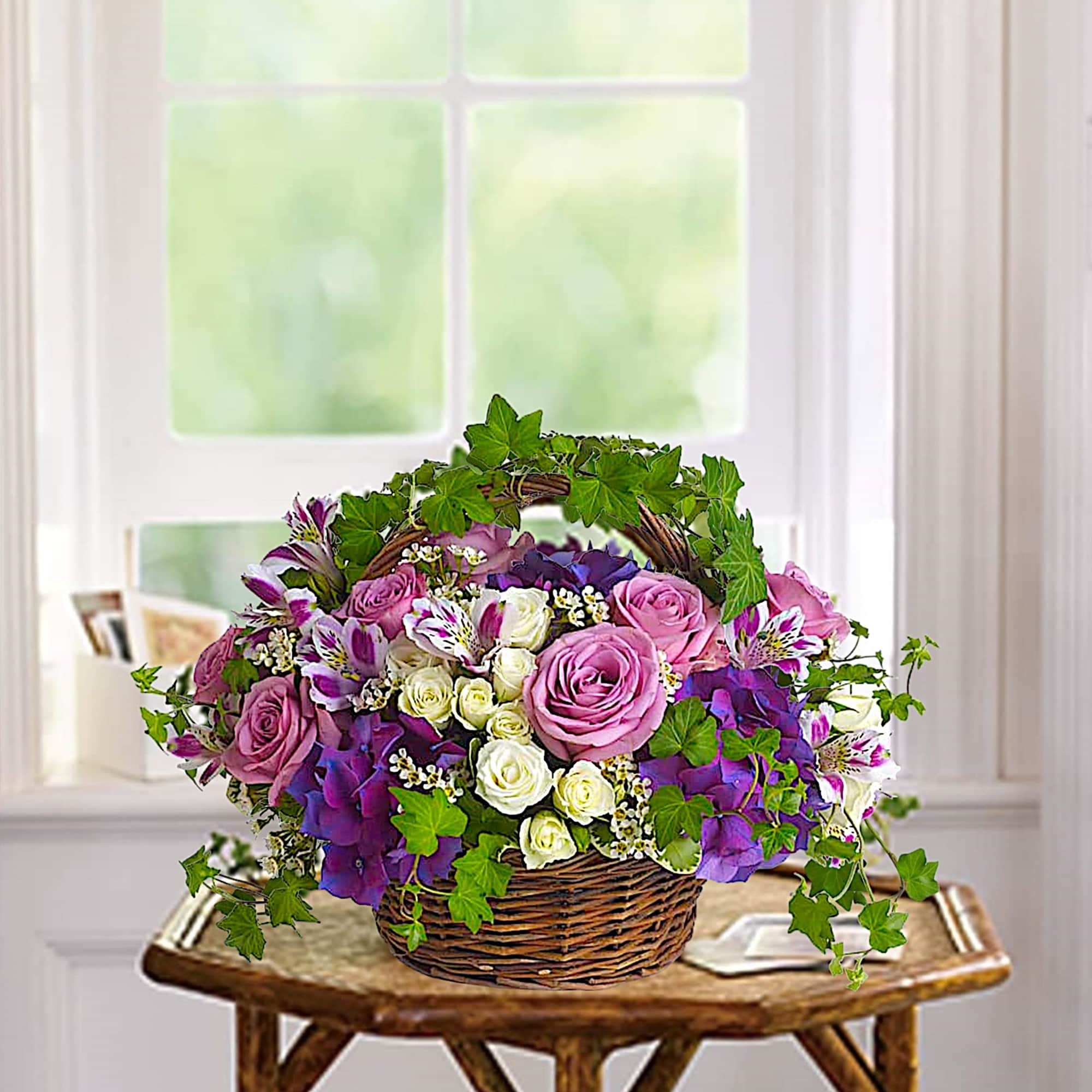 Lush flowers to celebrate a full life. This beautiful basket of flowers