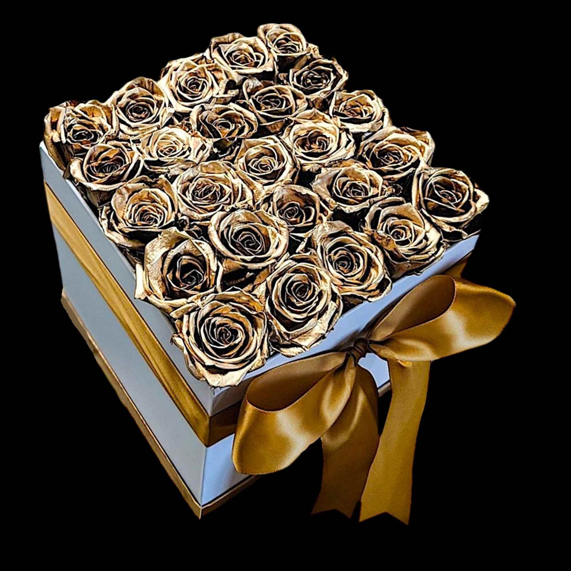 A modern flower arrangement in a white box filled with gold painted