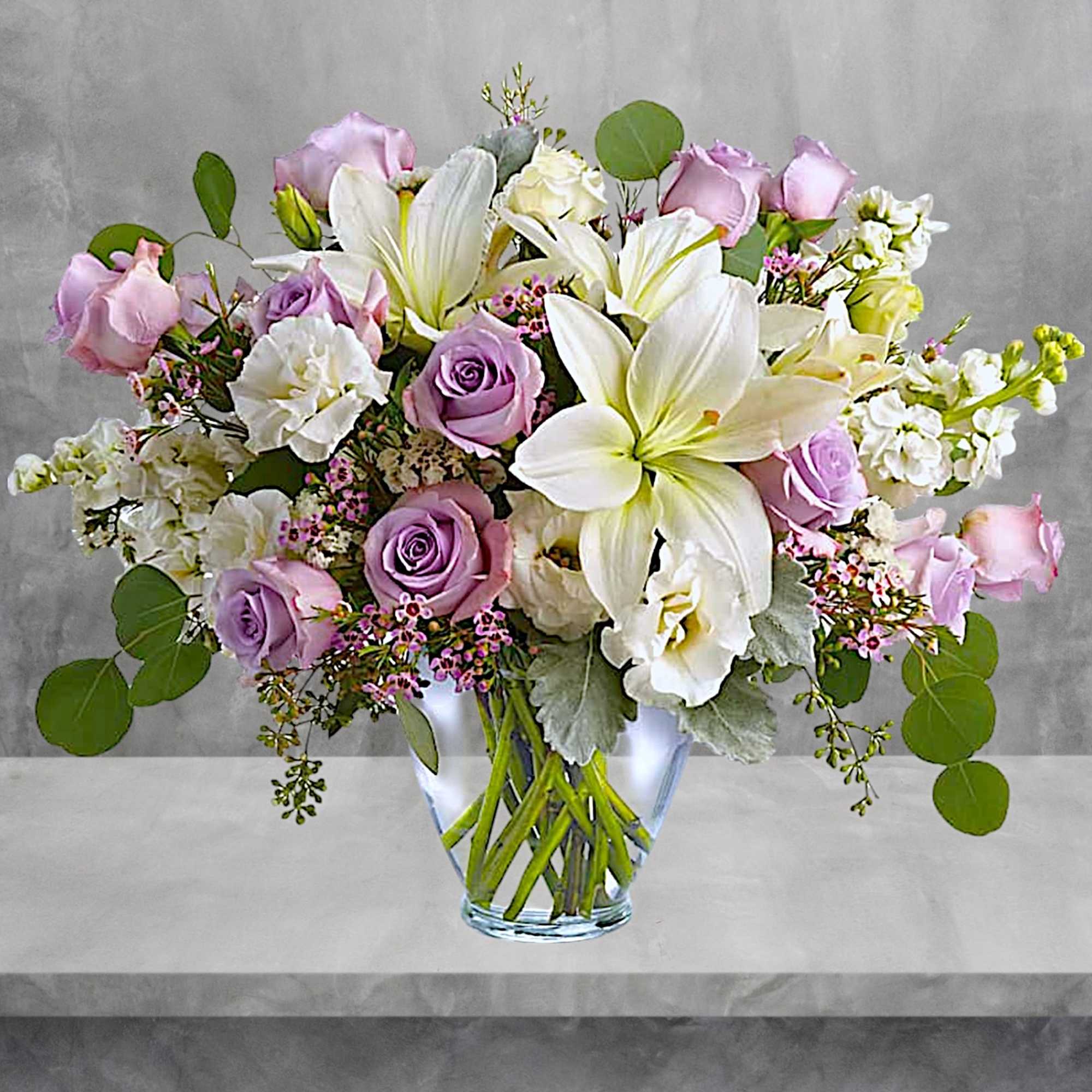 Luxe in love! Pale lavender roses, creamy white lilies and delicate greens