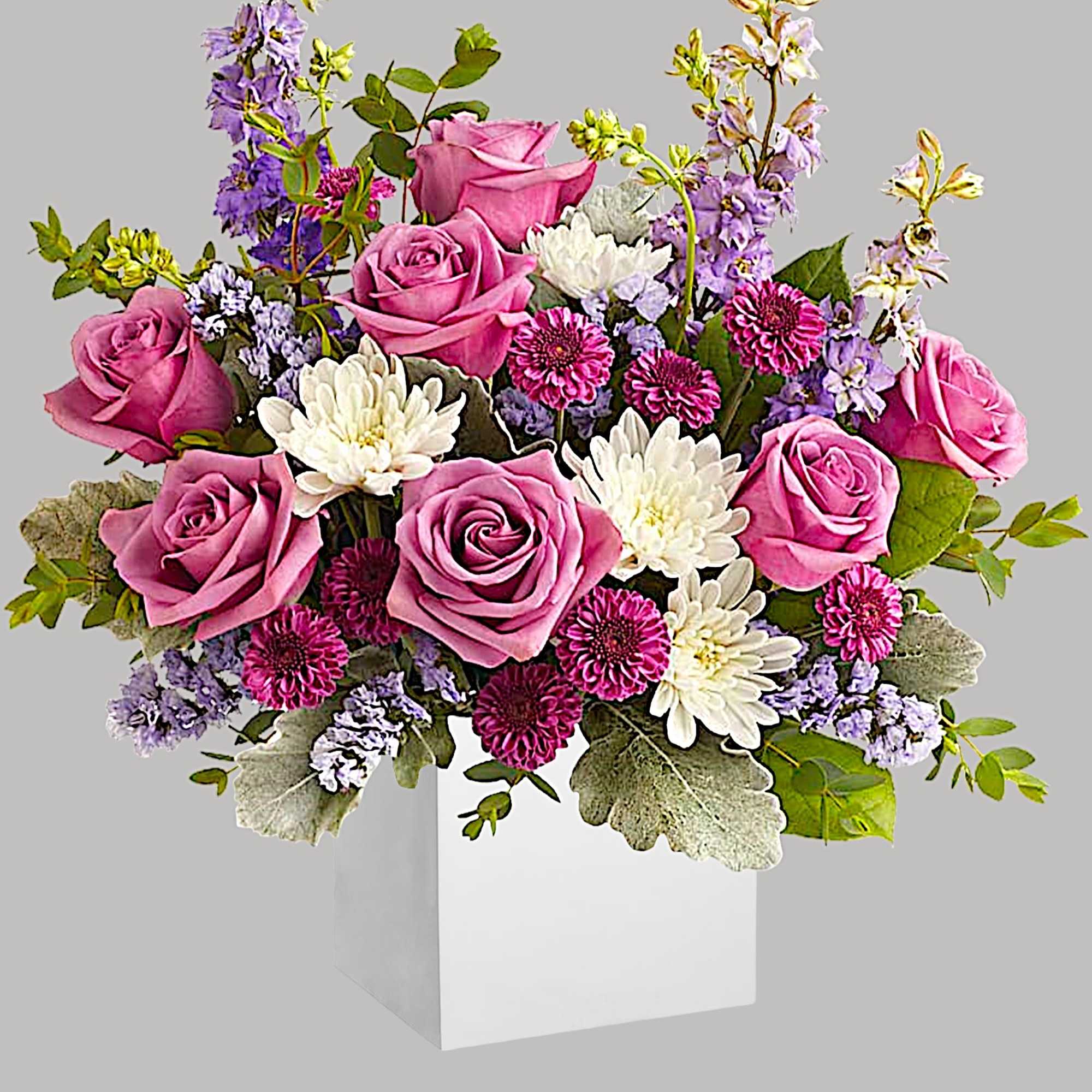 A playful spin on the classic rose arrangement, these lovely lavender blooms