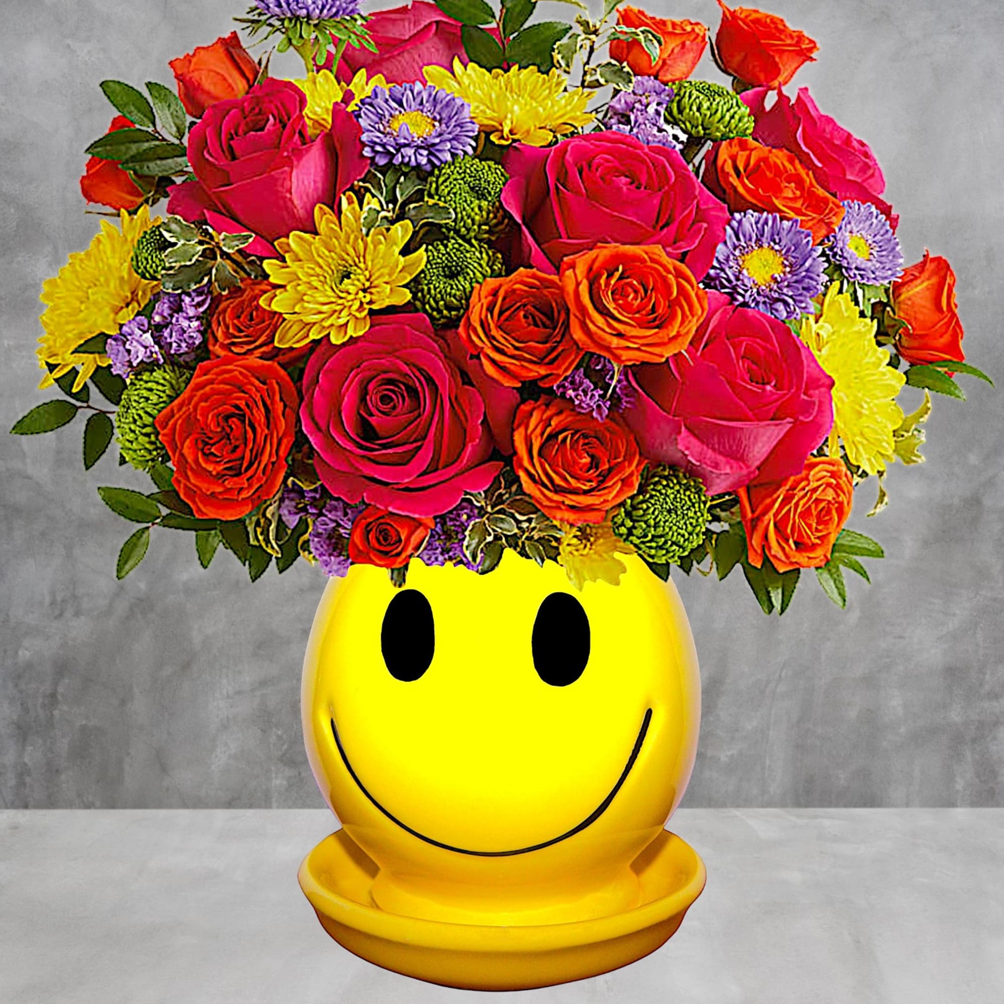 Happiness, delivered! Colorful roses in a cheerful ceramic planter are the quickest