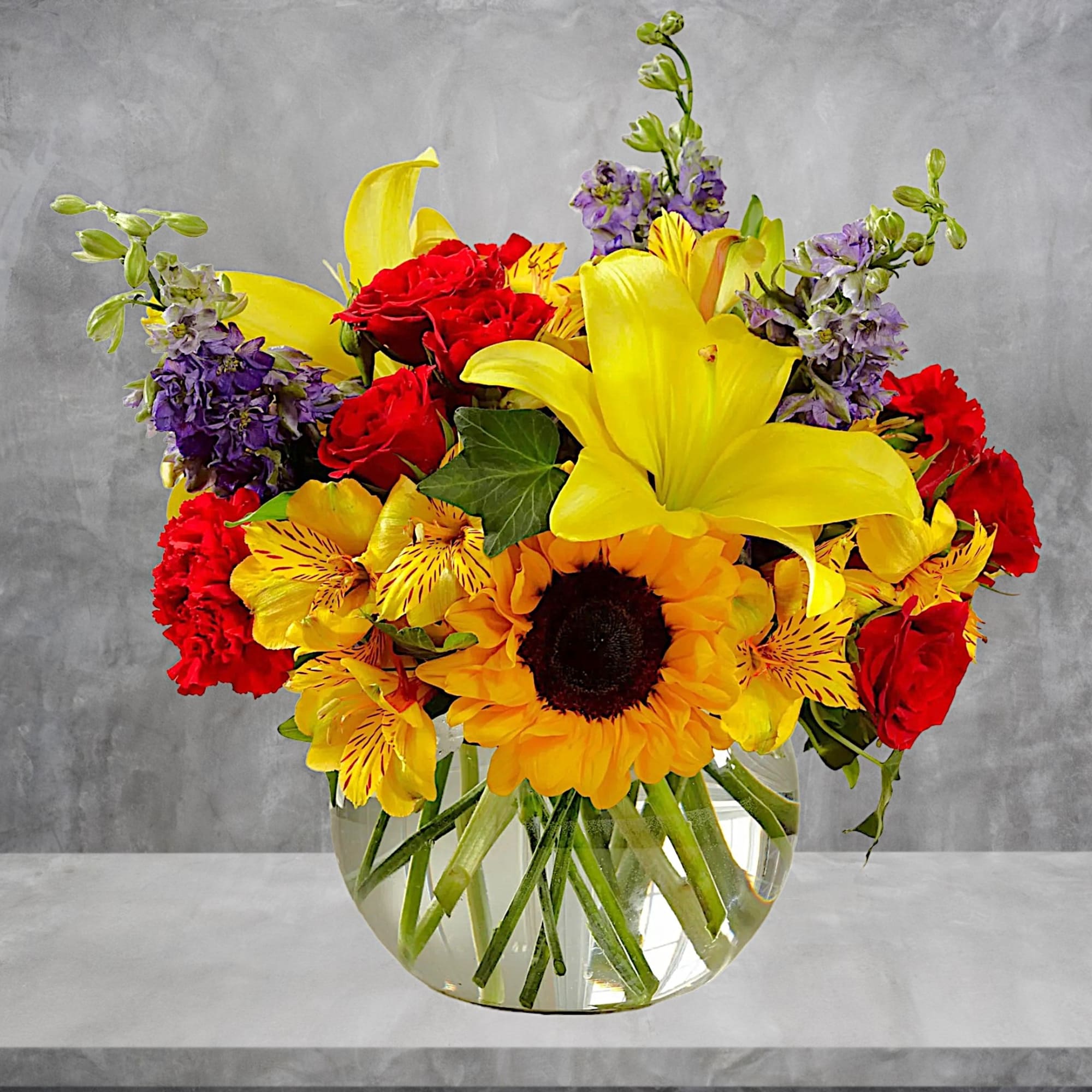 Beautiful and vibrant colors of alstroemeria, larkspur, spray roses, carnations, sunflowers, and