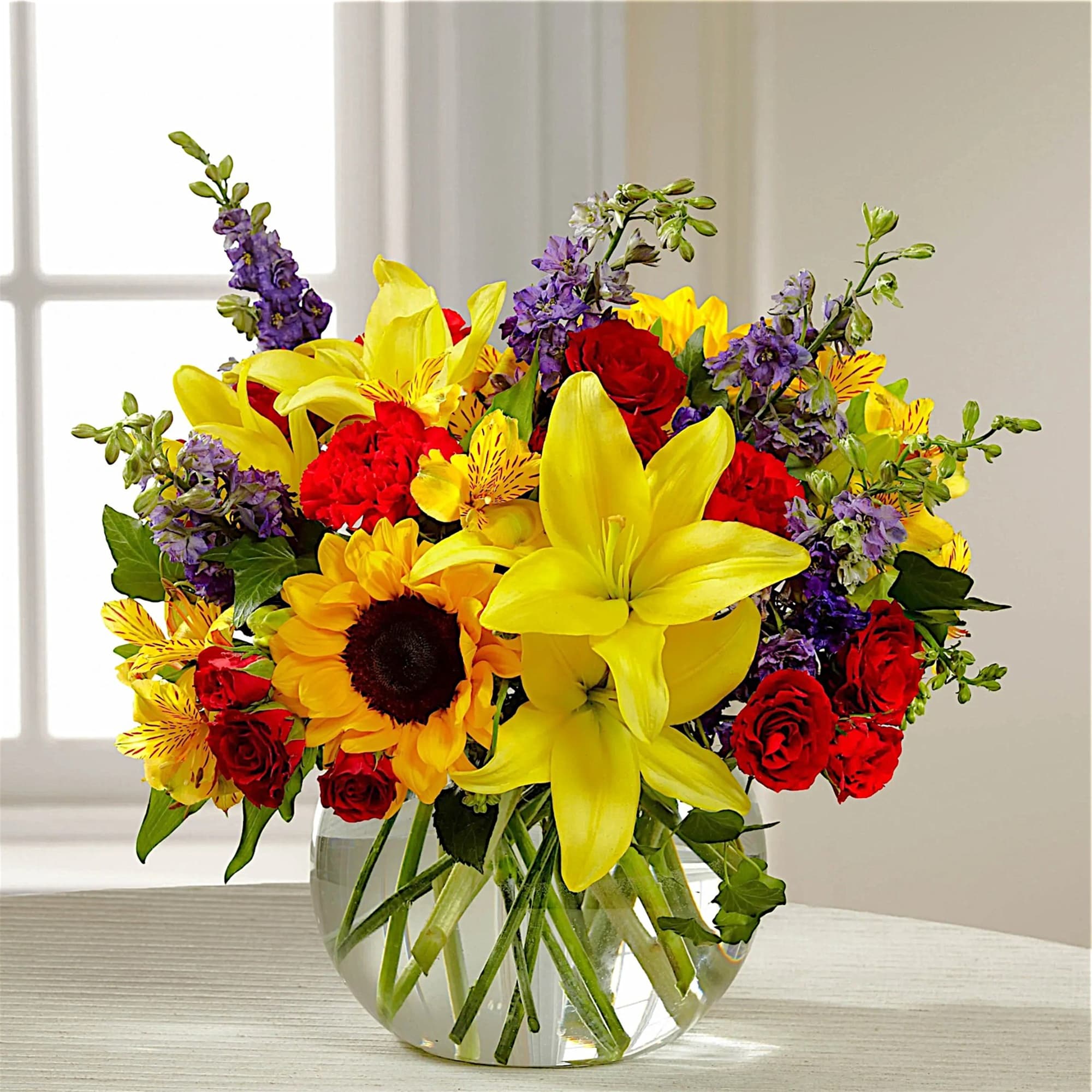 Beautiful and vibrant colors of alstroemeria, larkspur, spray roses, carnations, sunflowers, and