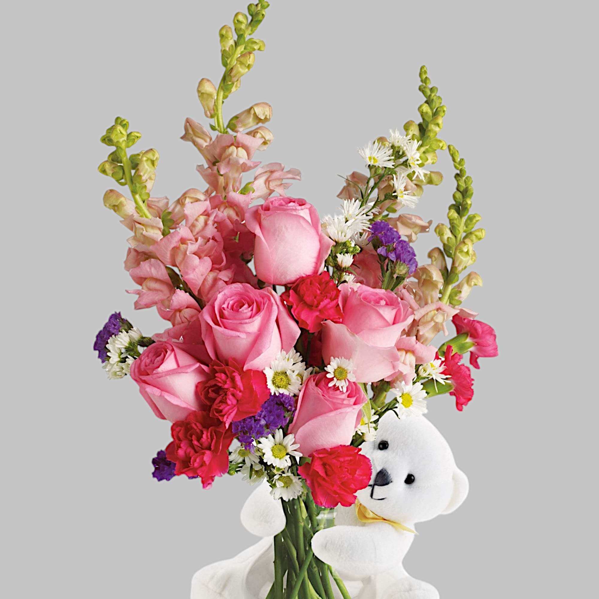 Send this adorable little bear with enchanting flowers, and someone special will