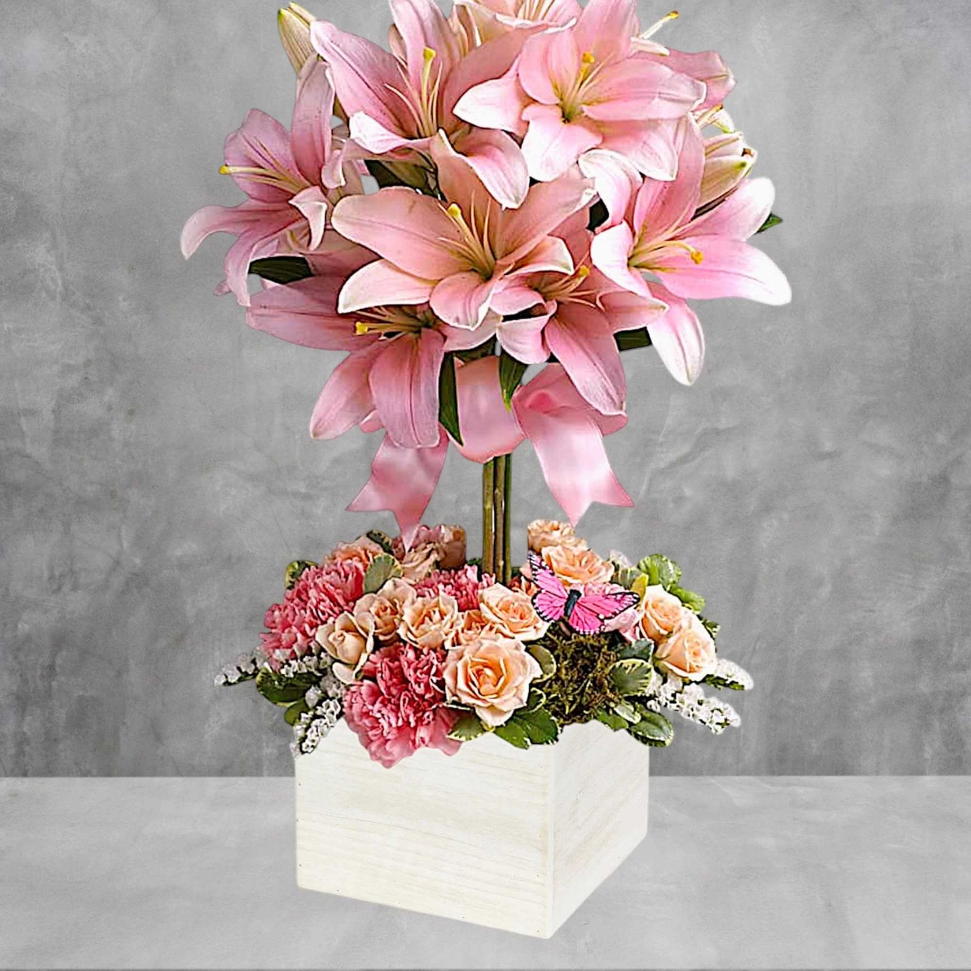 Send this blushing beauty of perfectly pink lilies, light pink roses and