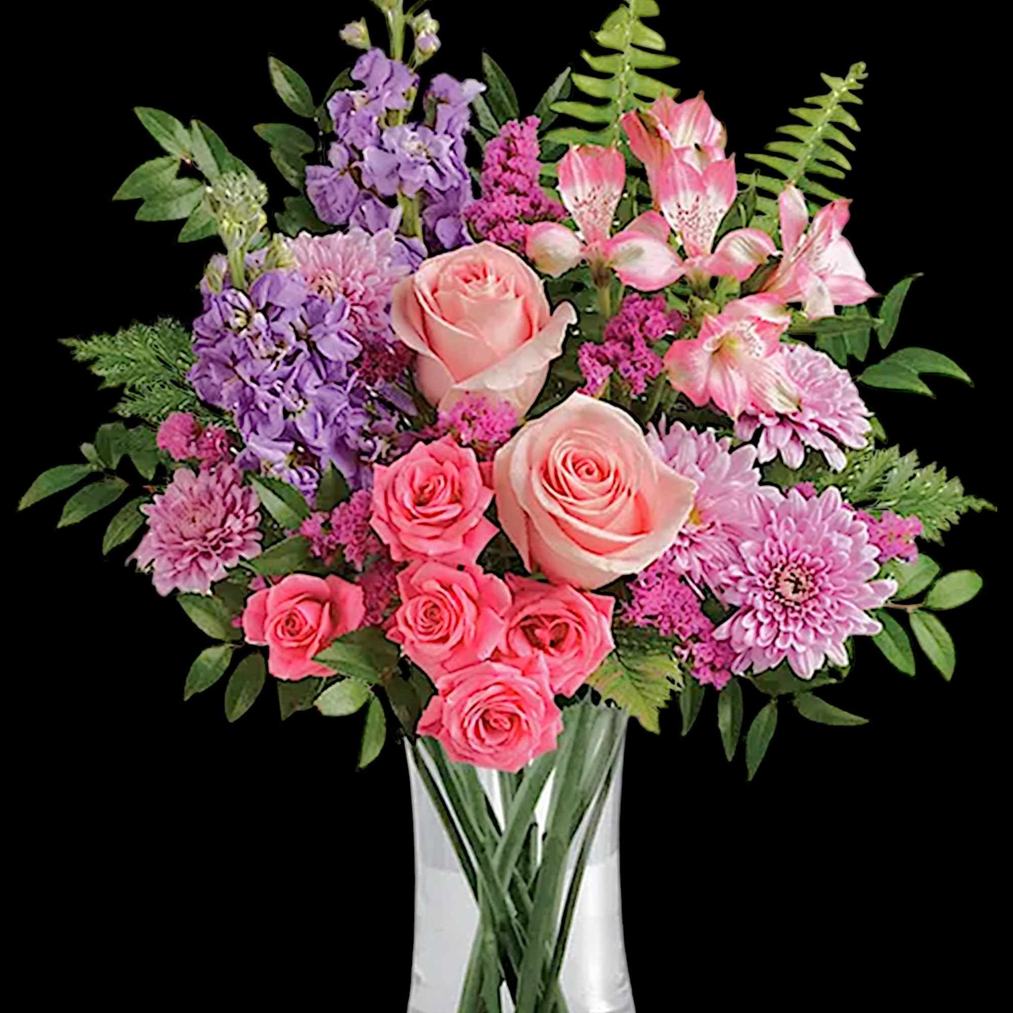 Soft pink roses breathe life into this perfectly feminine arrangement. This charming