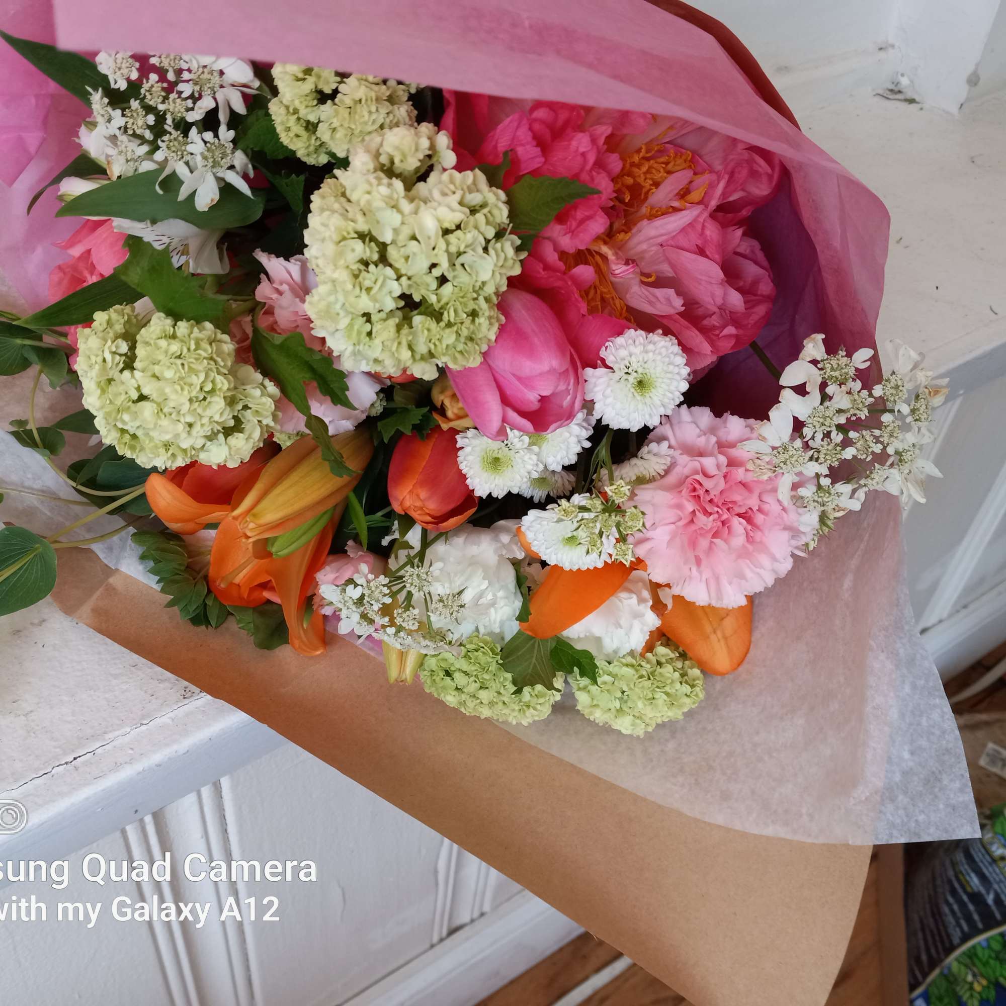 Urban - country feel hand tide wrap of assorted flowers