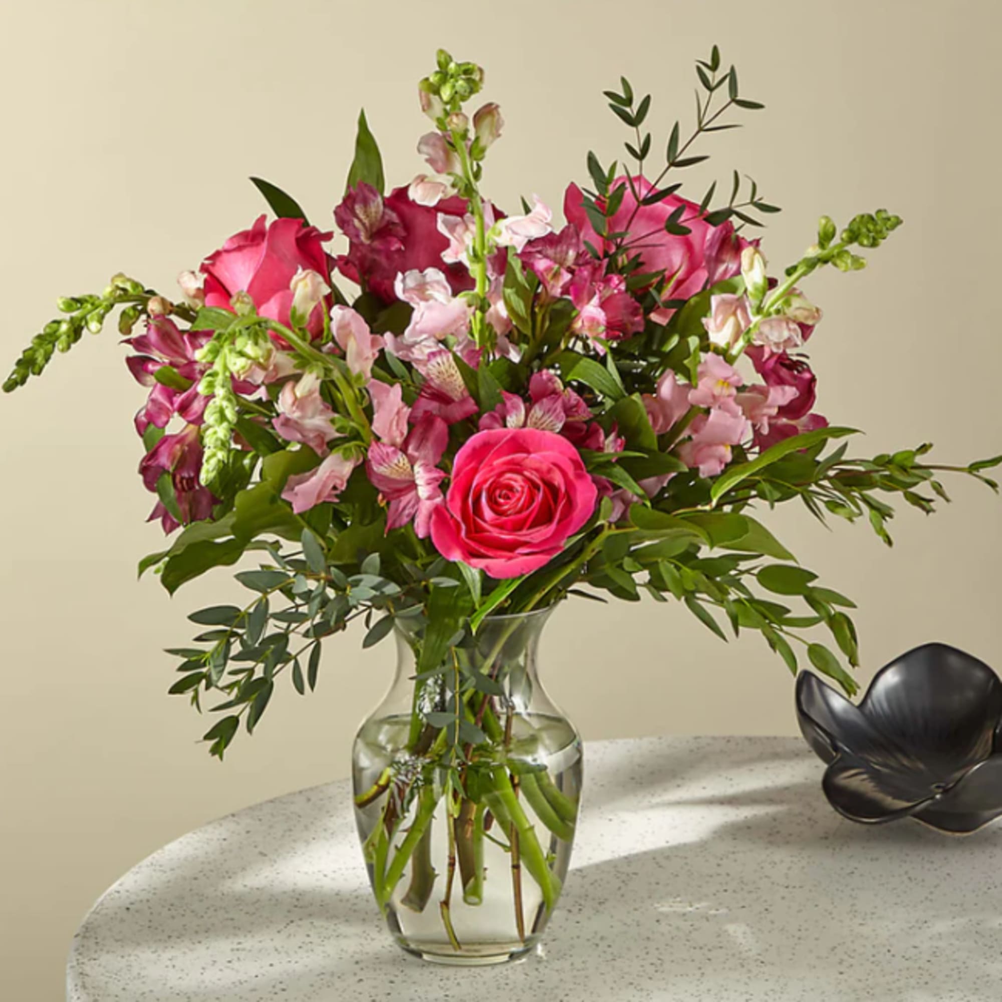 Fairytale&ndash;pink roses, hot pink alstroemeria, and pink snapdragons make an enchanting bouquet