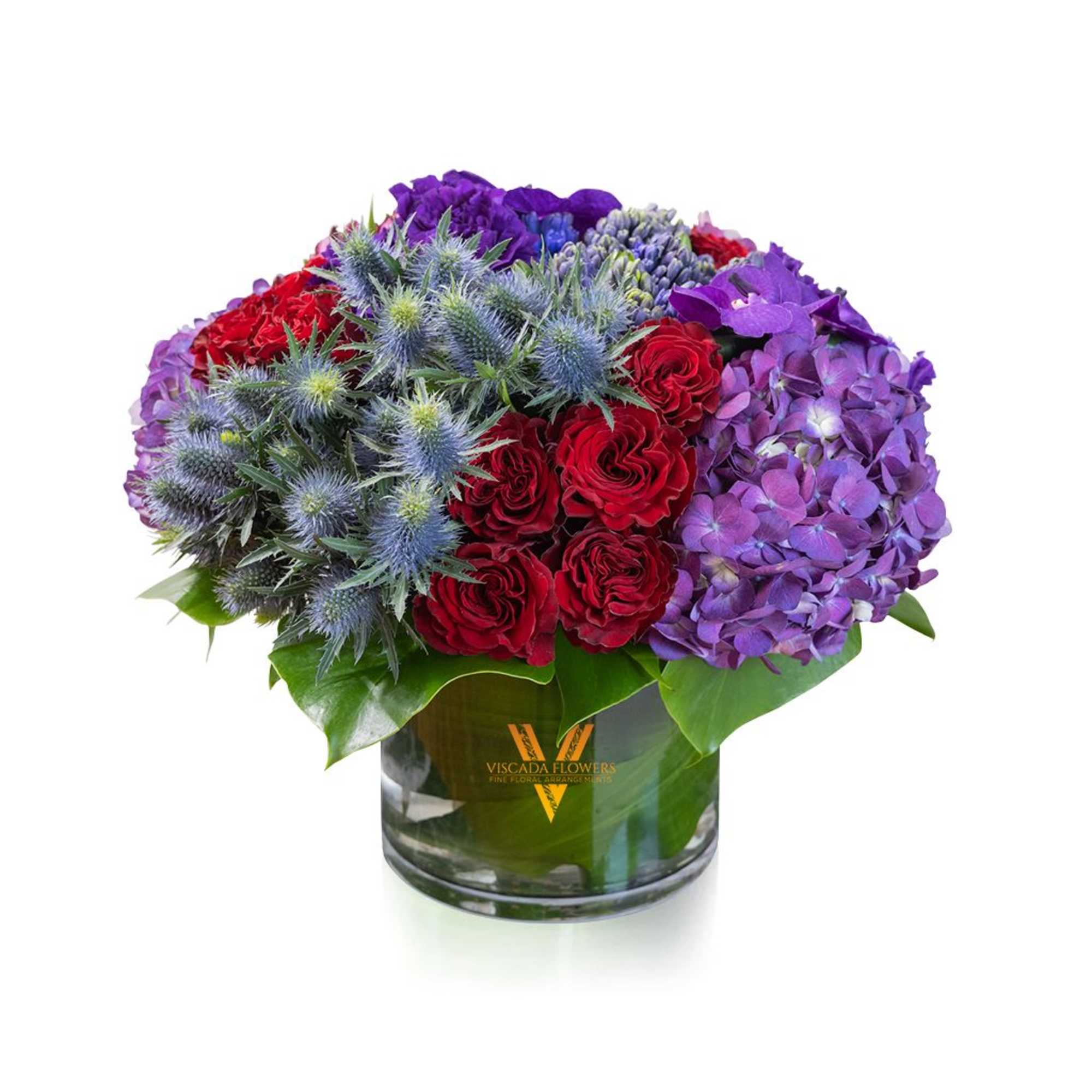 This captivating bouquet features red roses, purple hydrangeas, blue sea holly, muscaris