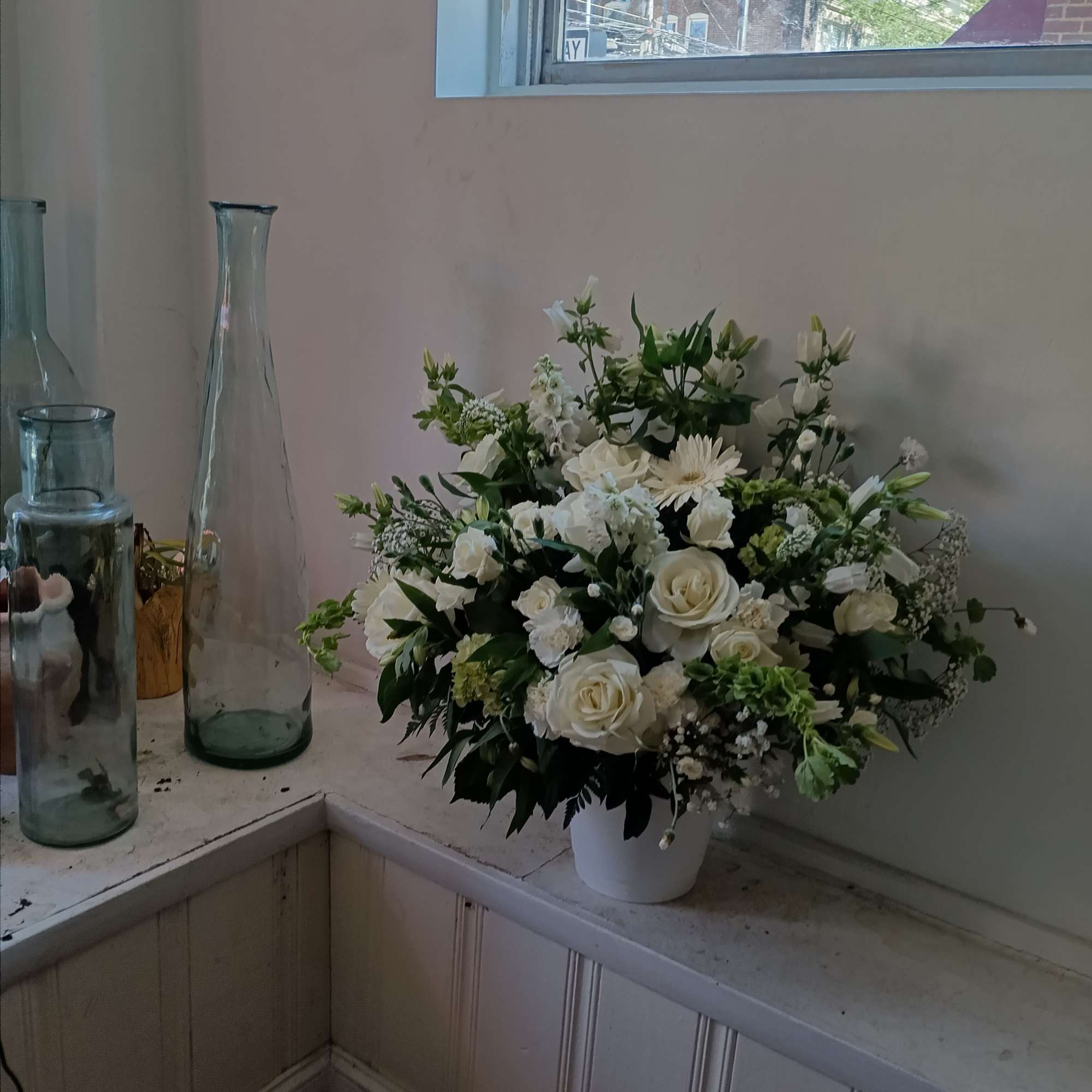 Gorgeous all white garden roses, roses, hydrangea, alsromera, gerbera daisy and other